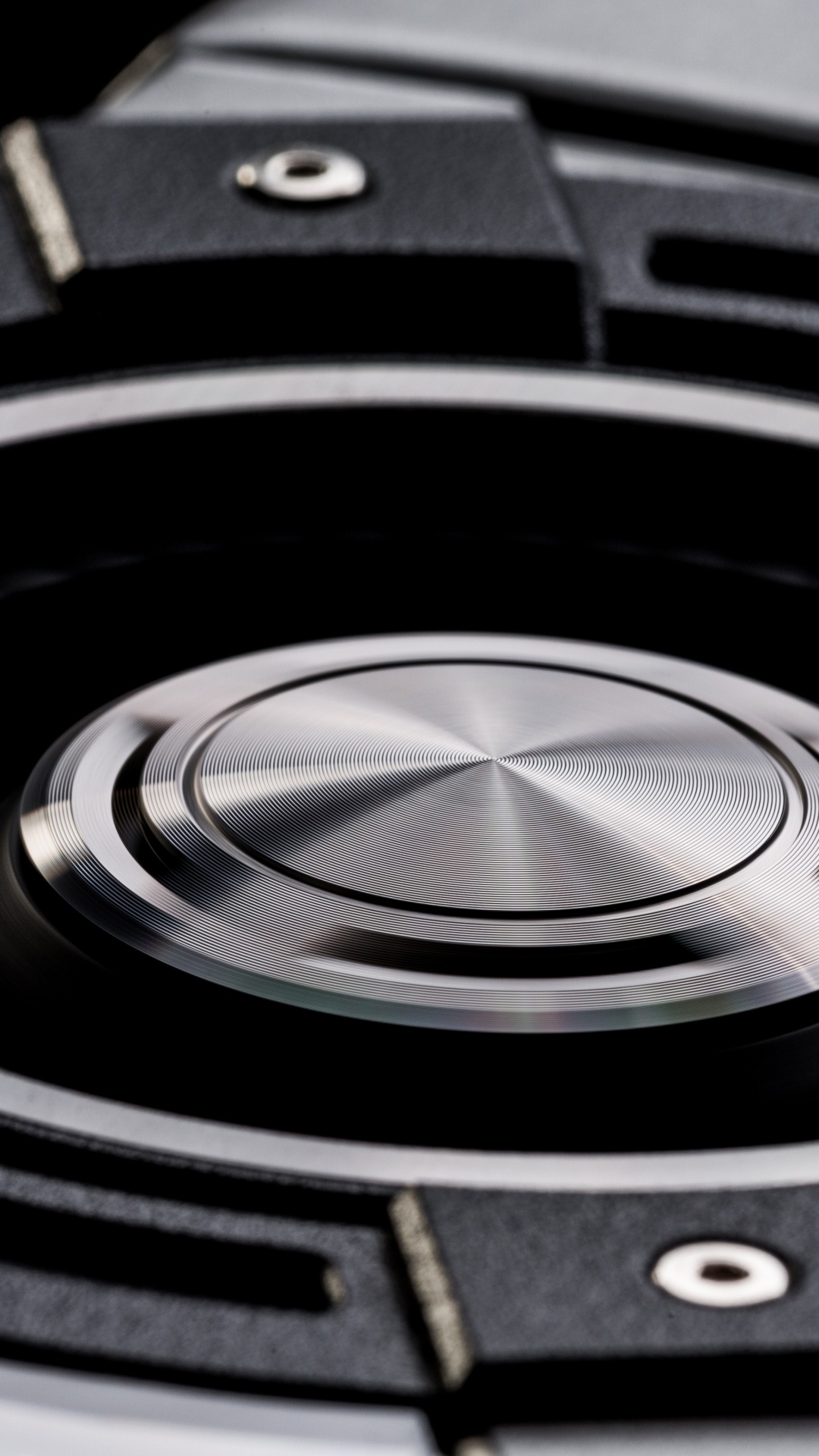 Schwarzes Und Silbernes Rundes Gerät. Wallpaper in 1080x1920 Resolution