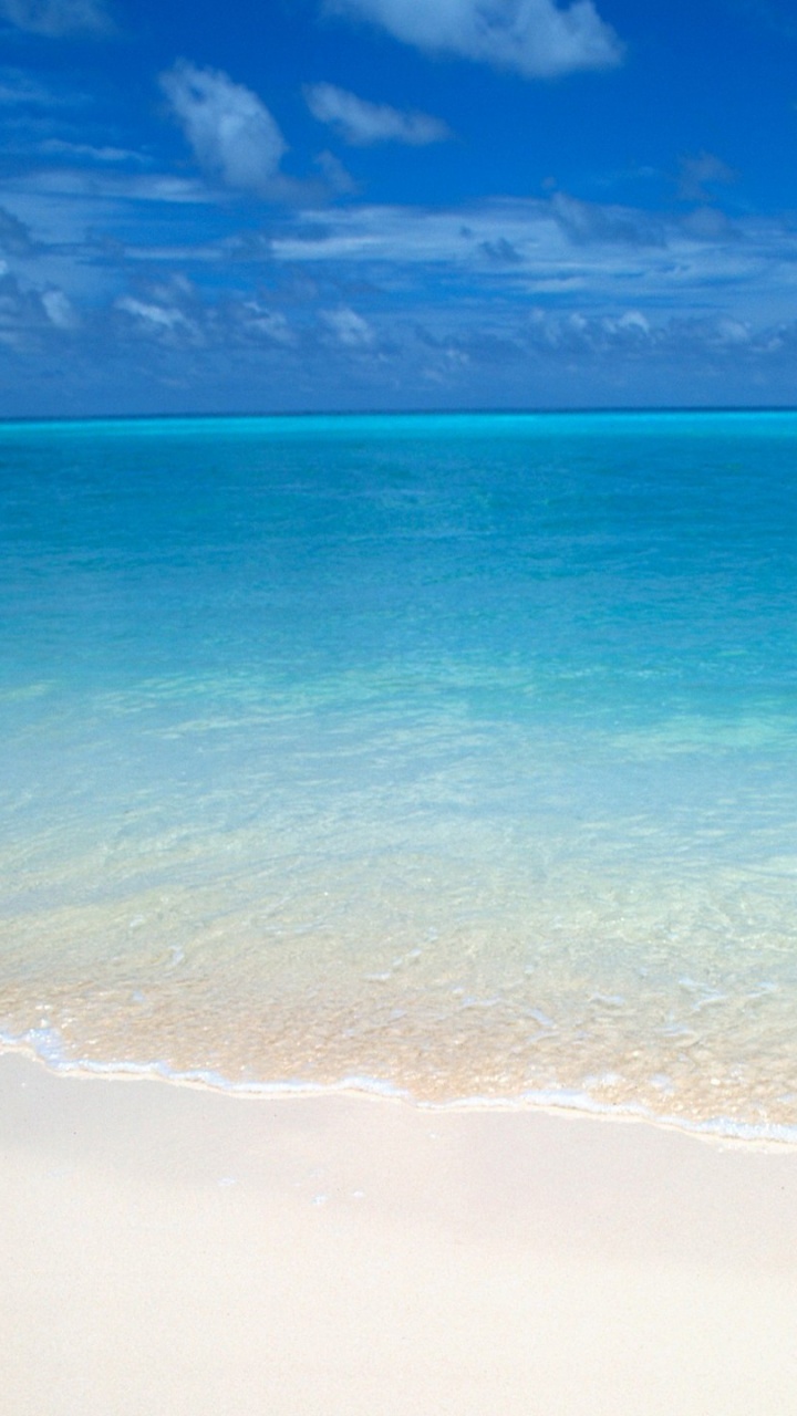 Vagues de la Mer se Brisant Sur le Rivage Pendant la Journée. Wallpaper in 720x1280 Resolution