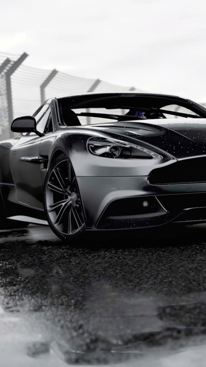 White and Black Porsche 911 on Snow Covered Ground. Wallpaper in 720x1280 Resolution