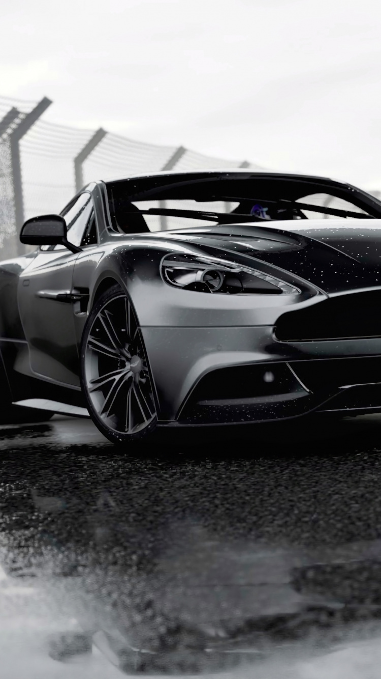 Porsche 911 Blanche et Noire Sur Sol Couvert de Neige. Wallpaper in 750x1334 Resolution