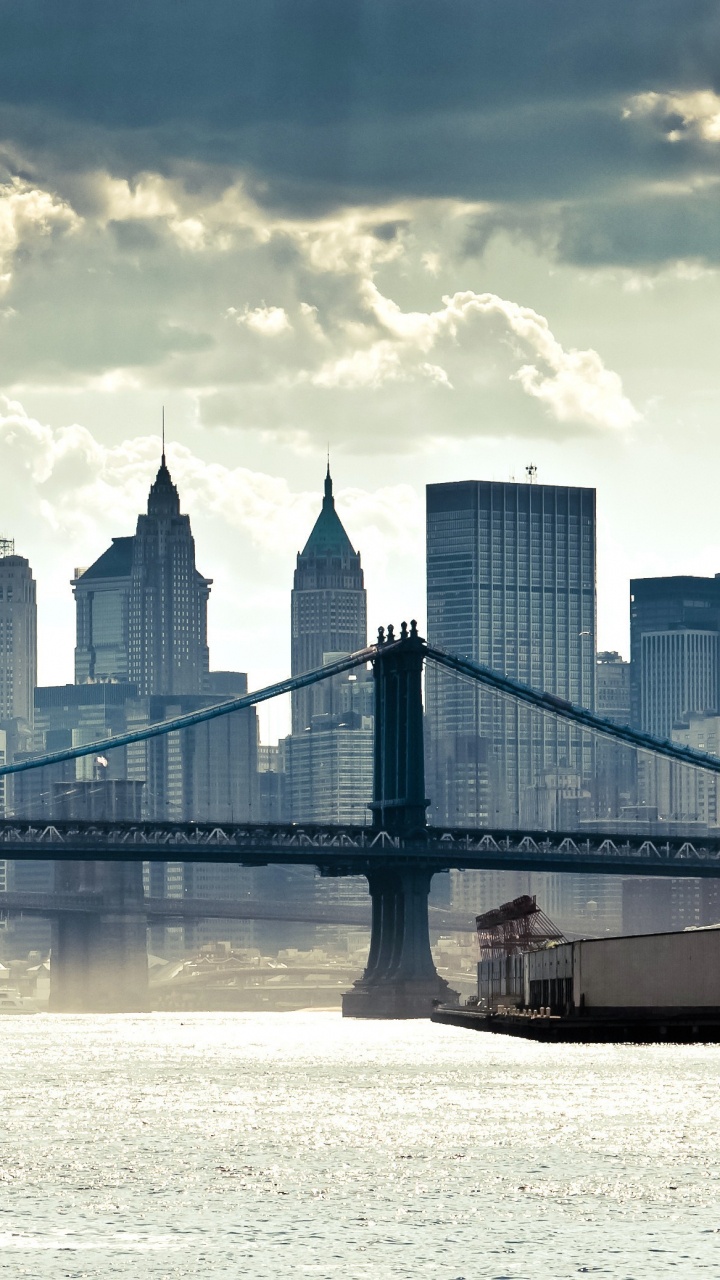 Bridge Over Water Near City Buildings During Daytime. Wallpaper in 720x1280 Resolution