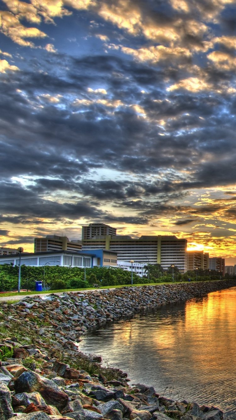 Body of Water Near Green Trees Under Cloudy Sky During Daytime. Wallpaper in 750x1334 Resolution