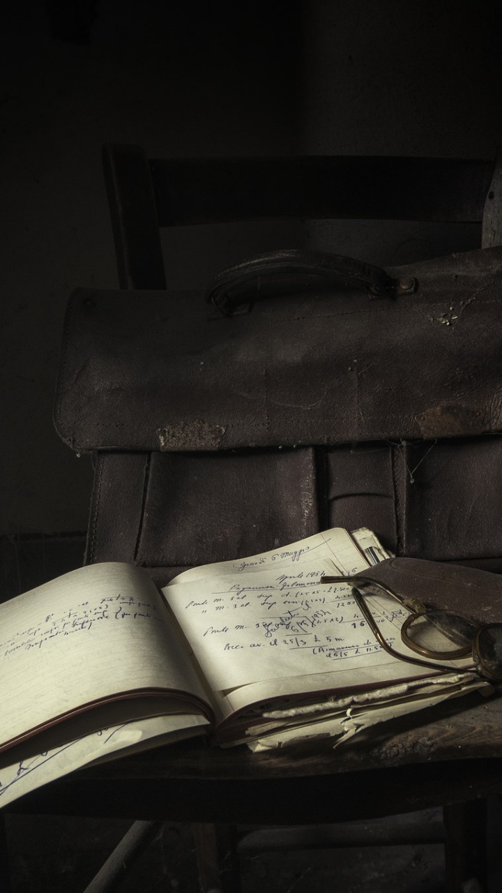 Brown Leather Bag on Brown Wooden Table. Wallpaper in 720x1280 Resolution