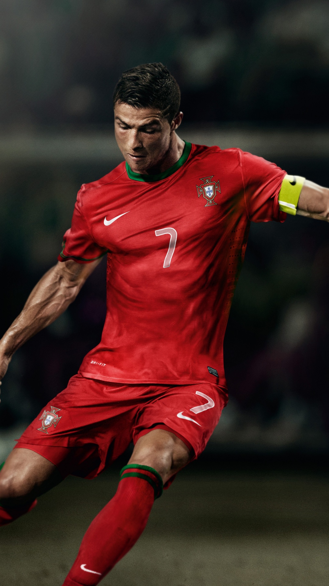 Man in Red Nike Soccer Jersey Shirt and Red Shorts Running on Field. Wallpaper in 1080x1920 Resolution