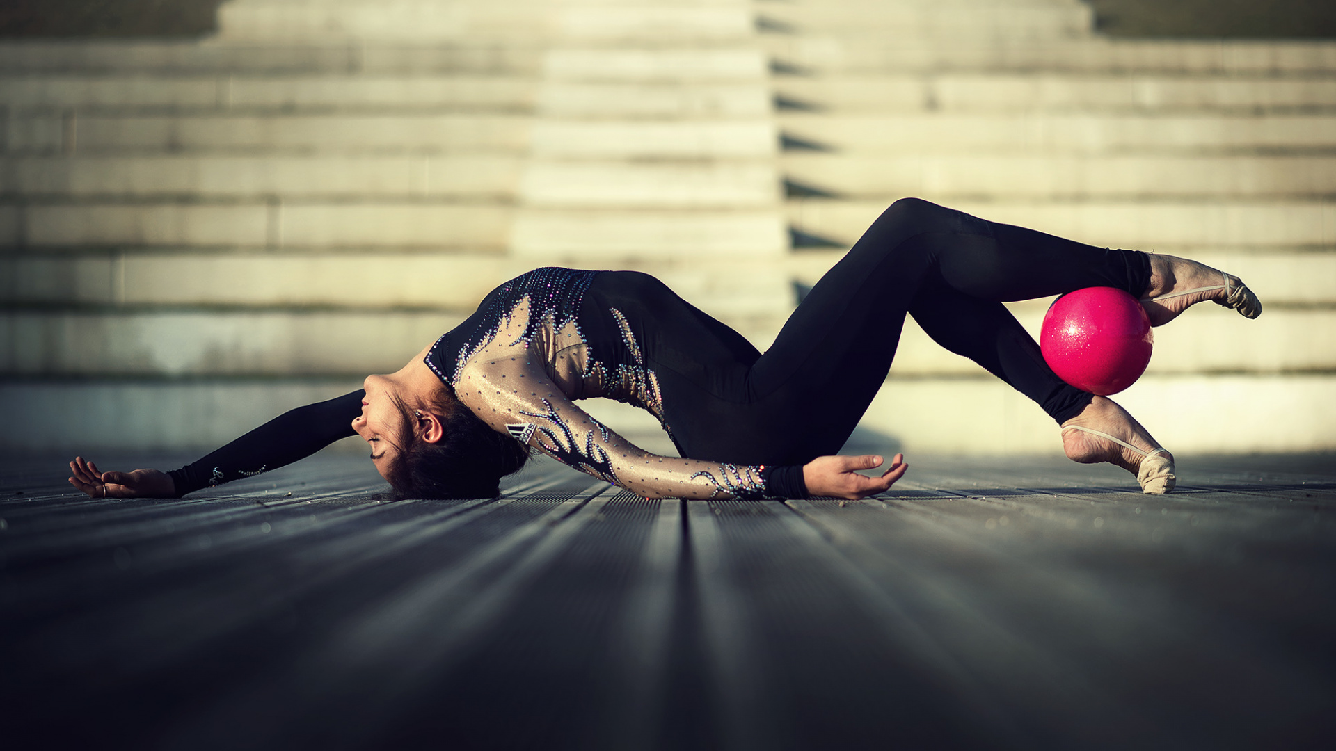 Woman in Black and White Long Sleeve Shirt and Black Pants Lying on Floor. Wallpaper in 1920x1080 Resolution