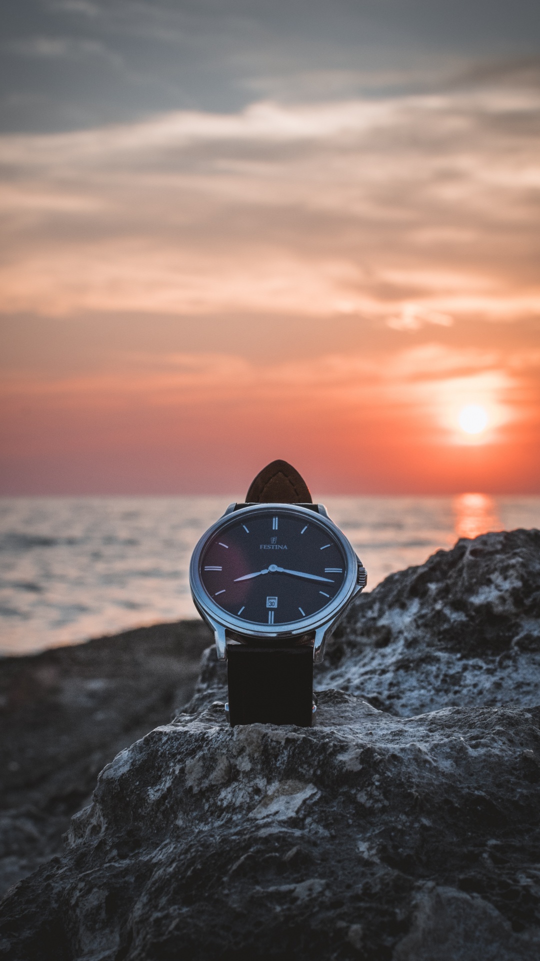 Black and White Analog Watch on Gray Rock Near Sea During Sunset. Wallpaper in 1080x1920 Resolution