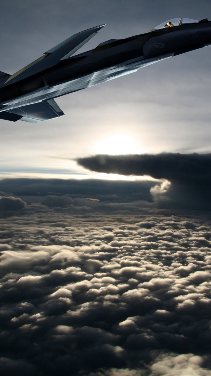 Avión a Reacción Gris Sobre Nubes Blancas Durante el Día. Wallpaper in 720x1280 Resolution