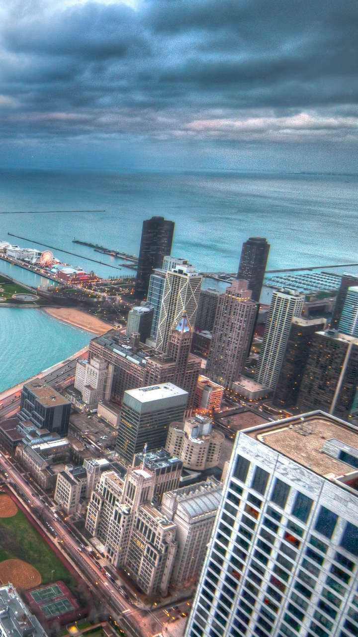Vista Aérea de Los Edificios de la Ciudad Cerca Del Cuerpo de Agua Durante el Día.. Wallpaper in 720x1280 Resolution