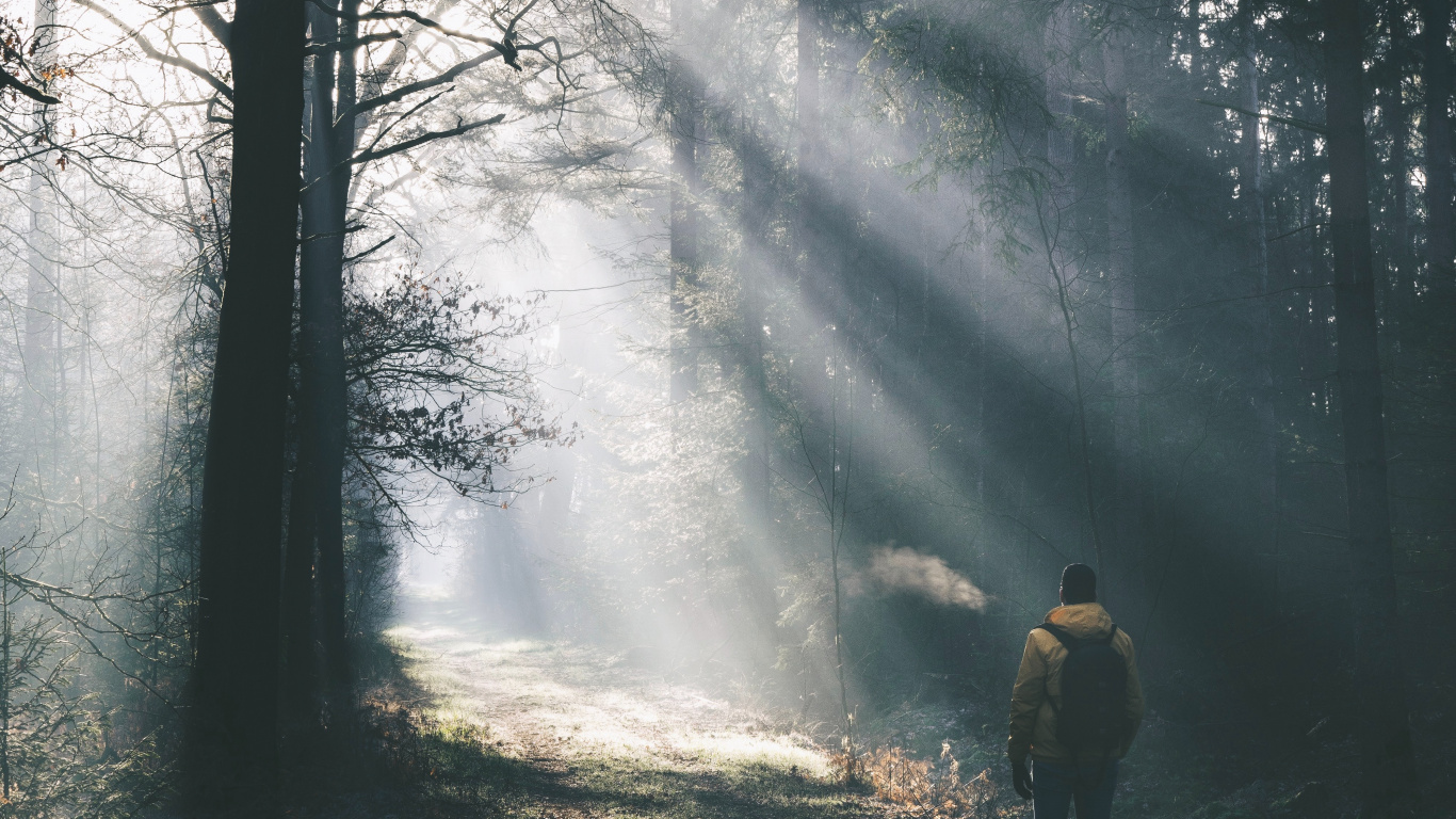 Man in Yellow Jacket Standing on Snow Covered Ground. Wallpaper in 1366x768 Resolution