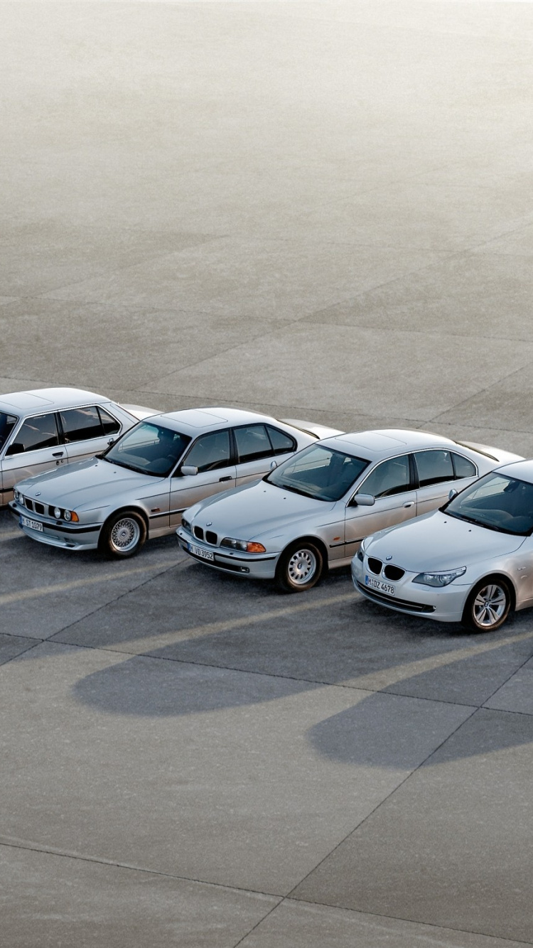 Silver and Black Cars on Gray Asphalt Road. Wallpaper in 750x1334 Resolution