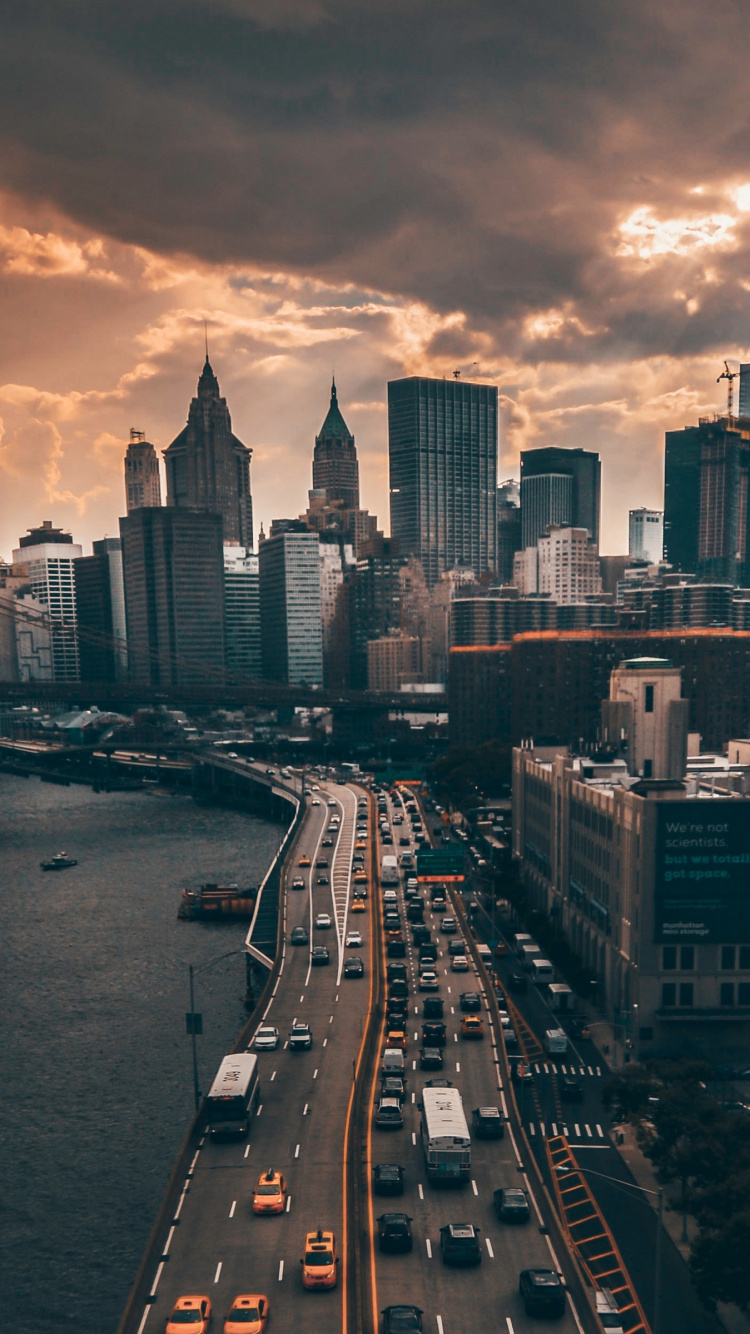 City Skyline Near Body of Water During Night Time. Wallpaper in 750x1334 Resolution
