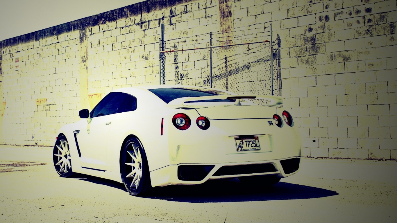 White Porsche 911 Parked Beside White Brick Wall. Wallpaper in 1366x768 Resolution