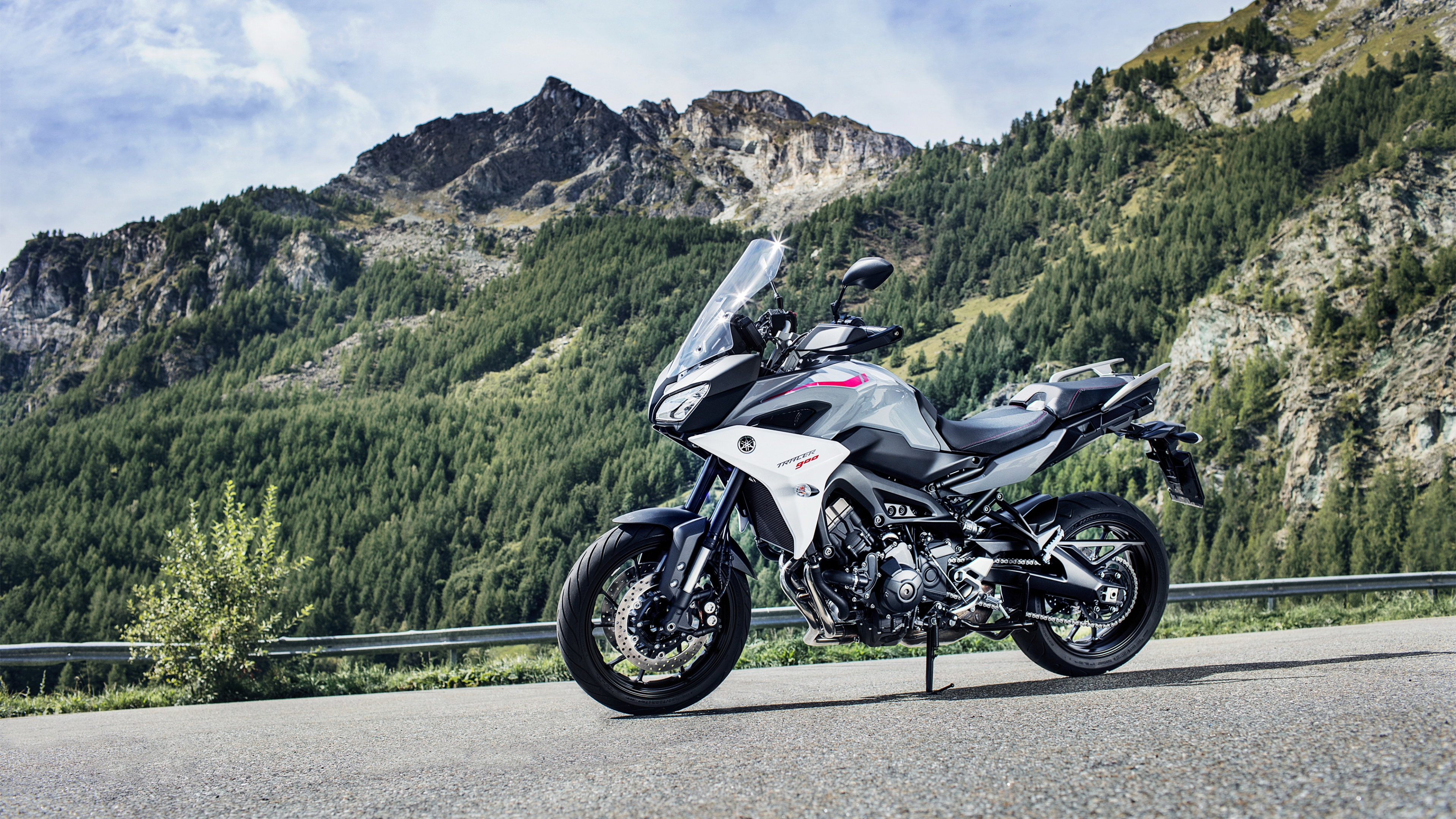 White and Black Sports Bike Parked on Green Grass Field Near Green Mountains During Daytime. Wallpaper in 3840x2160 Resolution