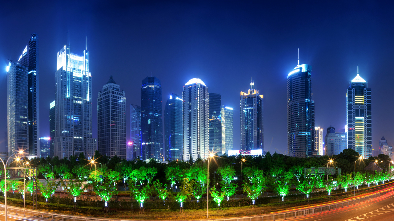 City Buildings With Lights Turned on During Night Time. Wallpaper in 1280x720 Resolution