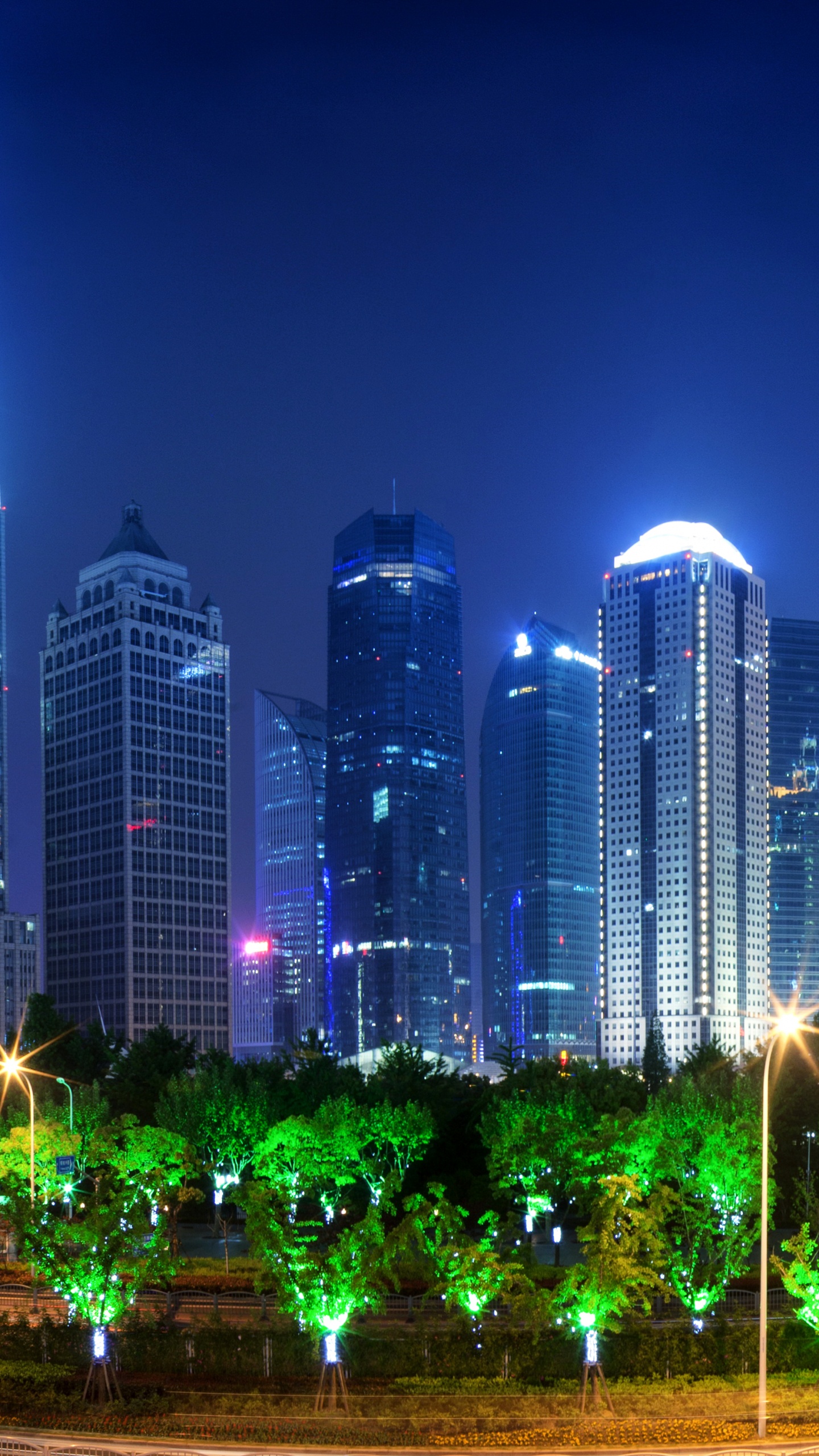 City Buildings With Lights Turned on During Night Time. Wallpaper in 1440x2560 Resolution