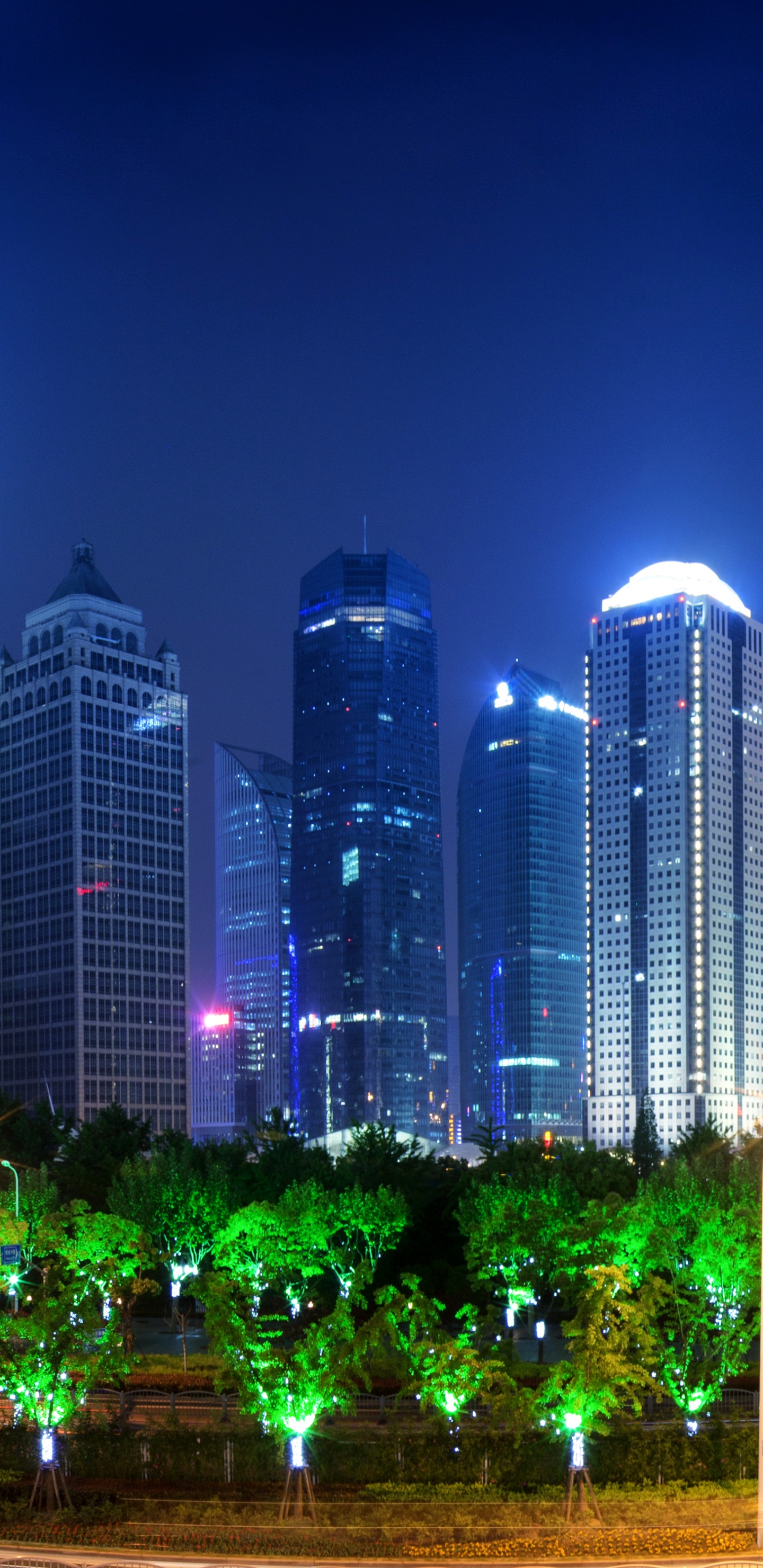 City Buildings With Lights Turned on During Night Time. Wallpaper in 1440x2960 Resolution