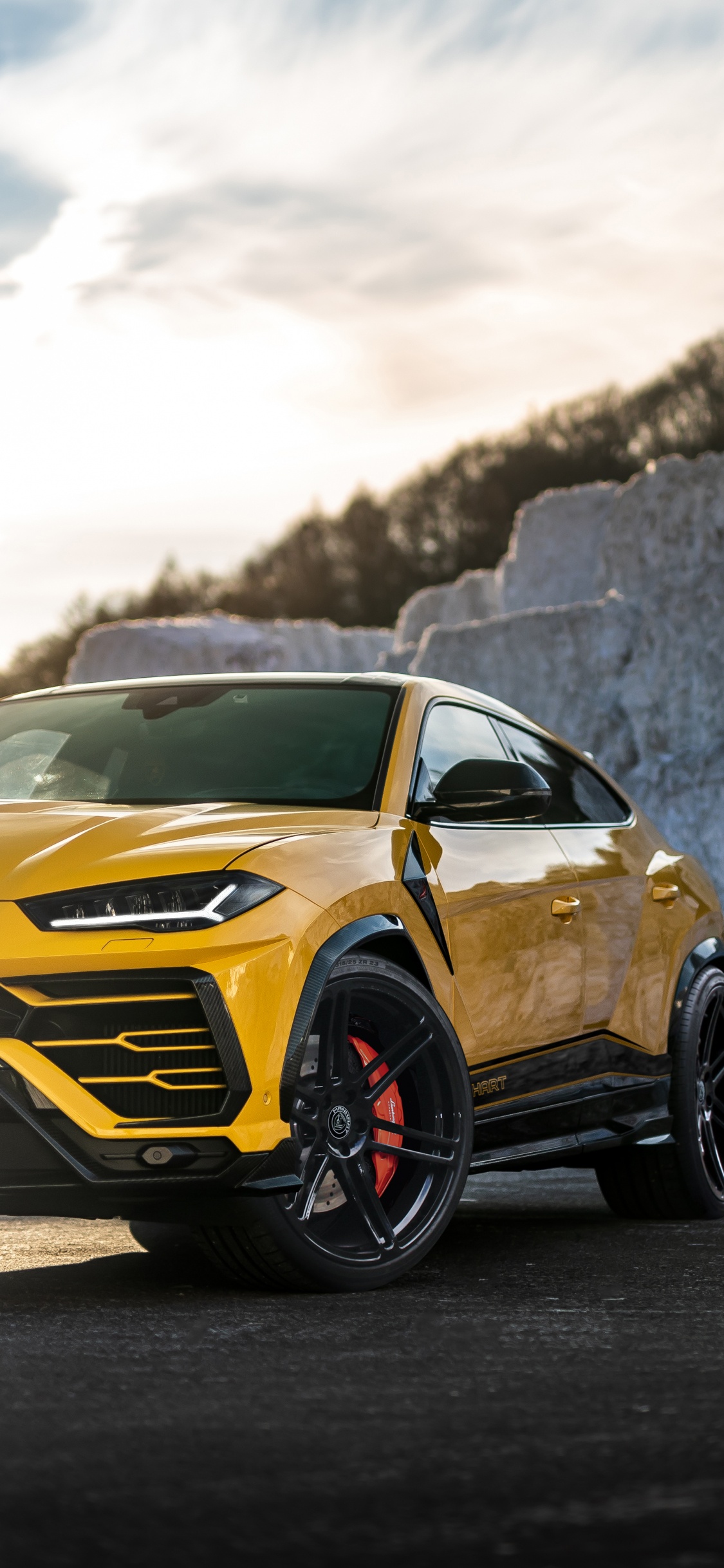Yellow and Black Chevrolet Camaro on Road During Daytime. Wallpaper in 1125x2436 Resolution