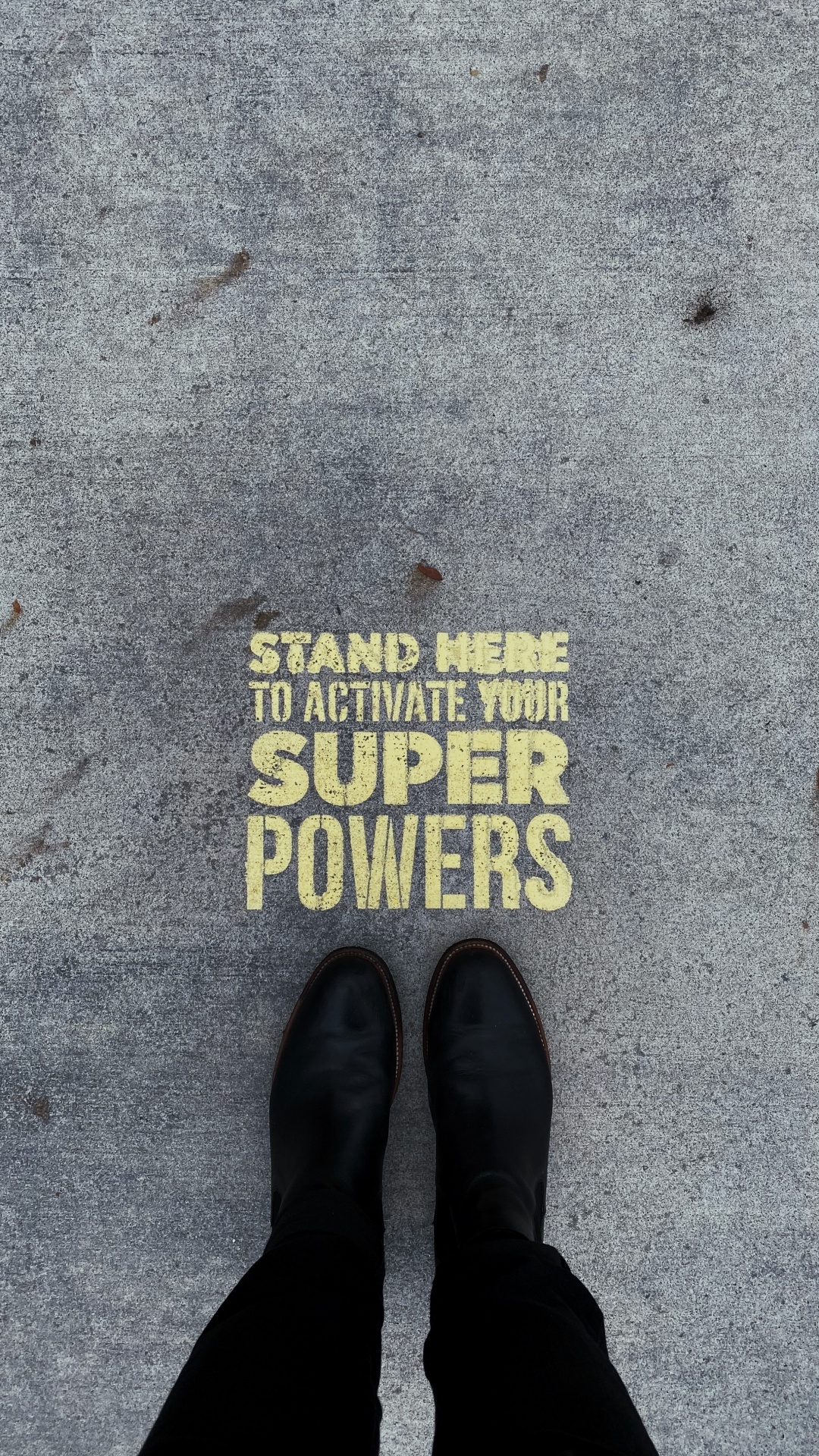 Person Wearing Black Leather Shoes Standing on Gray Concrete Floor. Wallpaper in 1080x1920 Resolution