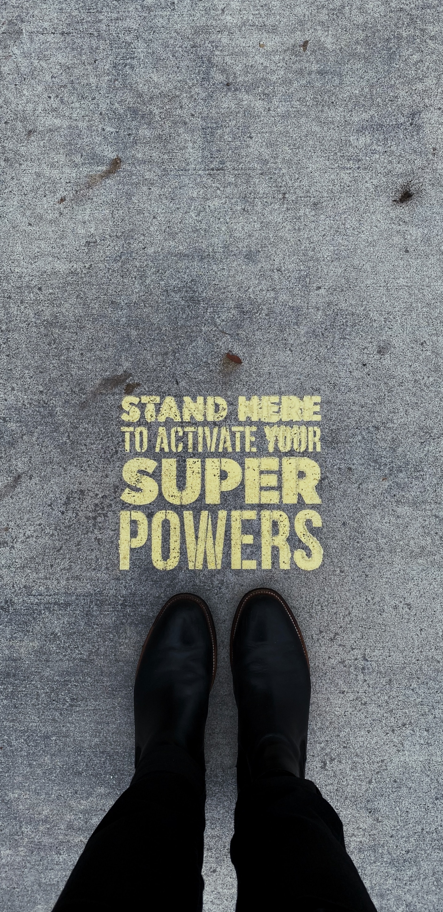 Person Wearing Black Leather Shoes Standing on Gray Concrete Floor. Wallpaper in 1440x2960 Resolution