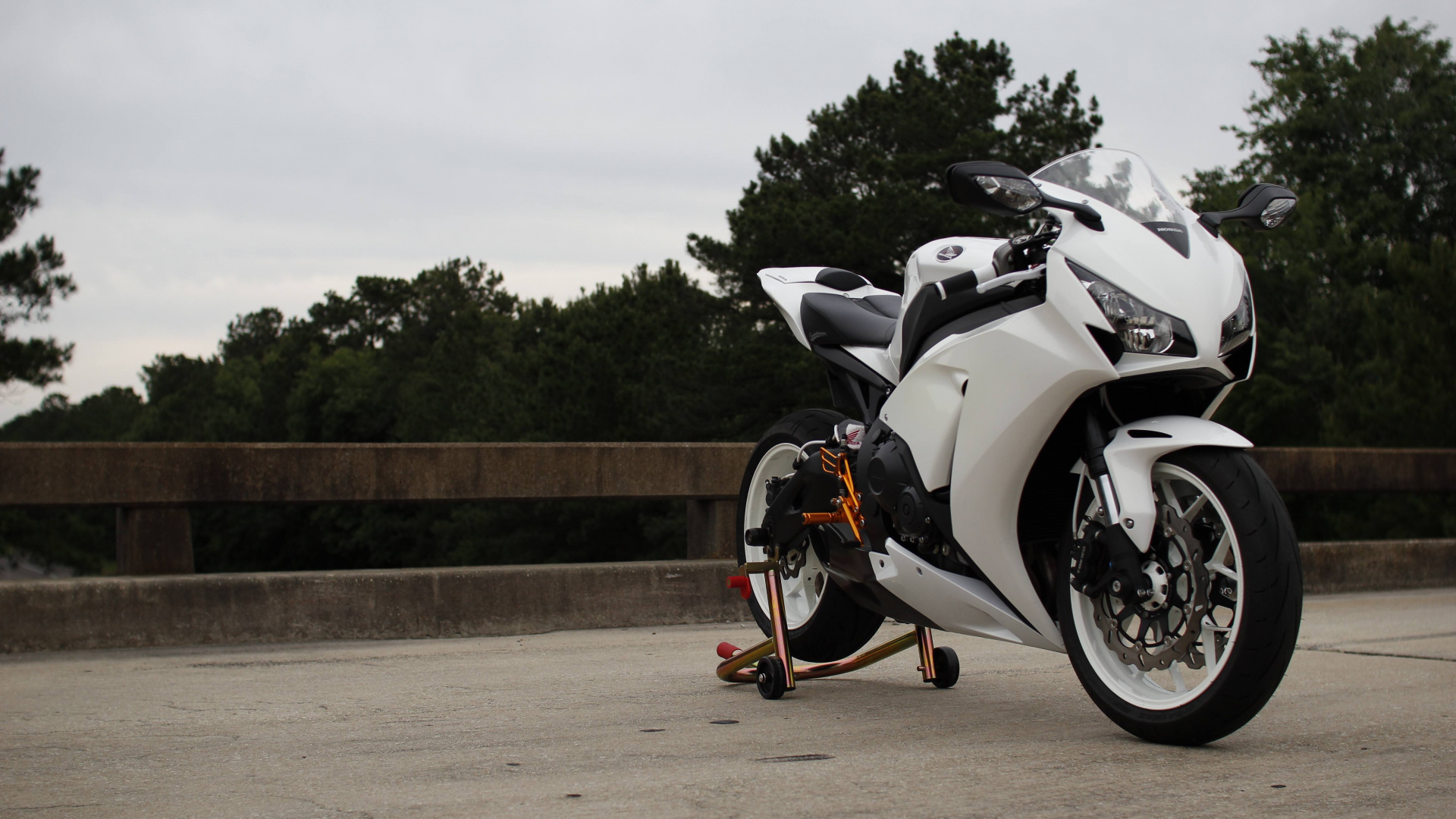 Black and White Sports Bike Parked on Brown Dirt Road During Daytime. Wallpaper in 1920x1080 Resolution