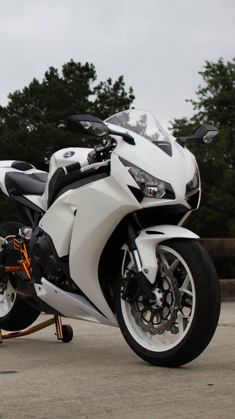 Black and White Sports Bike Parked on Brown Dirt Road During Daytime. Wallpaper in 750x1334 Resolution