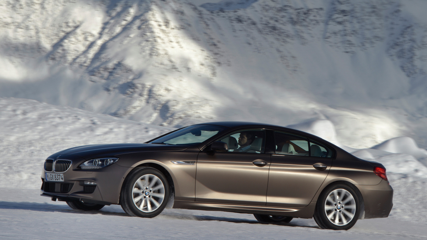 Black Mercedes Benz c Class Coupe on Snow Covered Ground During Daytime. Wallpaper in 1366x768 Resolution