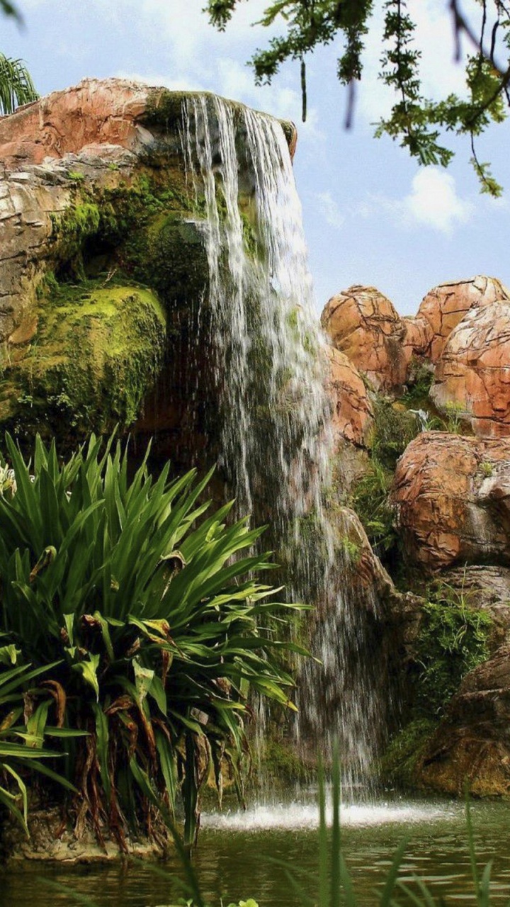 Brown Rock Formation Near Water Falls During Daytime. Wallpaper in 720x1280 Resolution