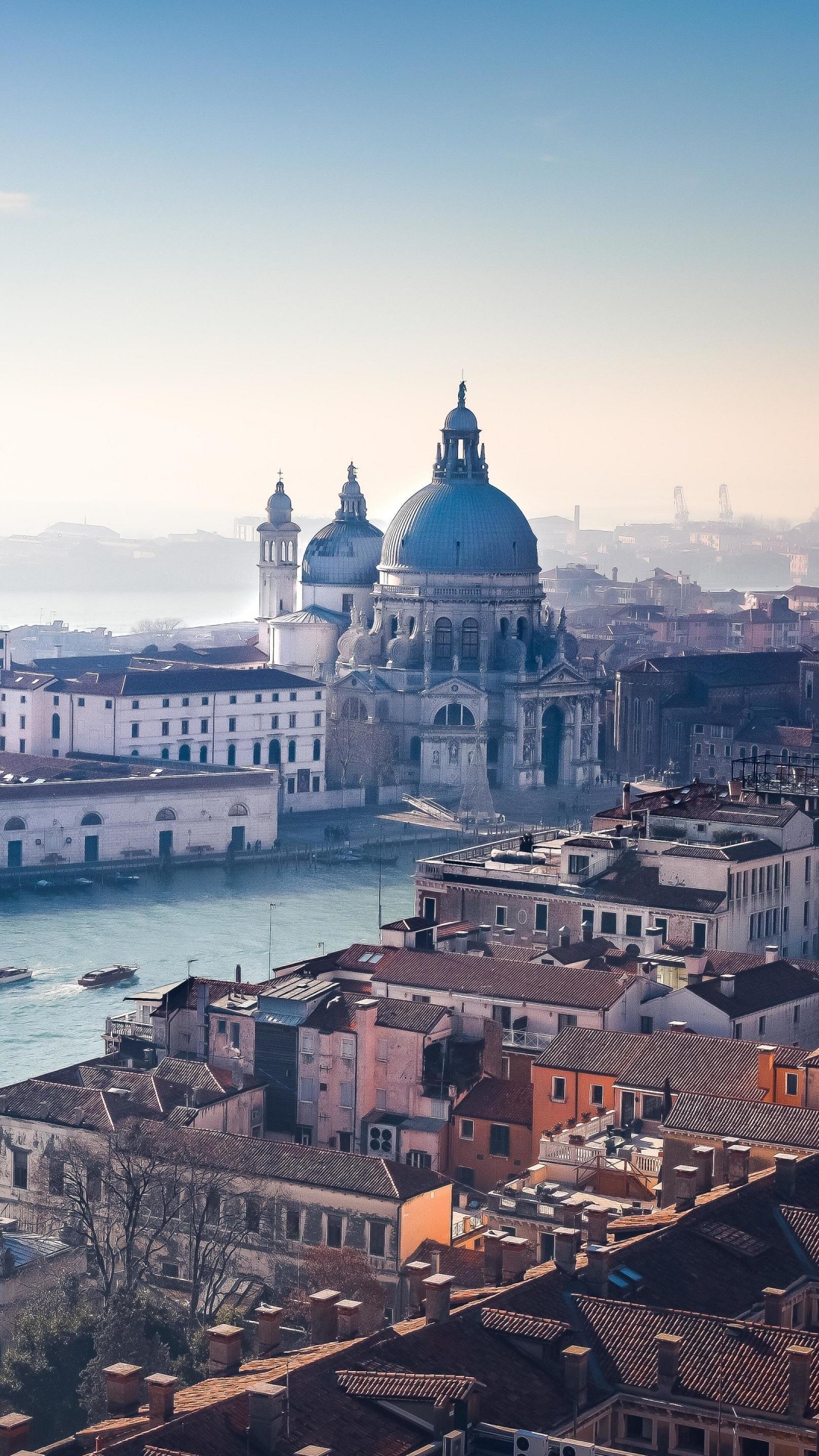 White and Brown Concrete Building Near Body of Water During Daytime. Wallpaper in 1080x1920 Resolution