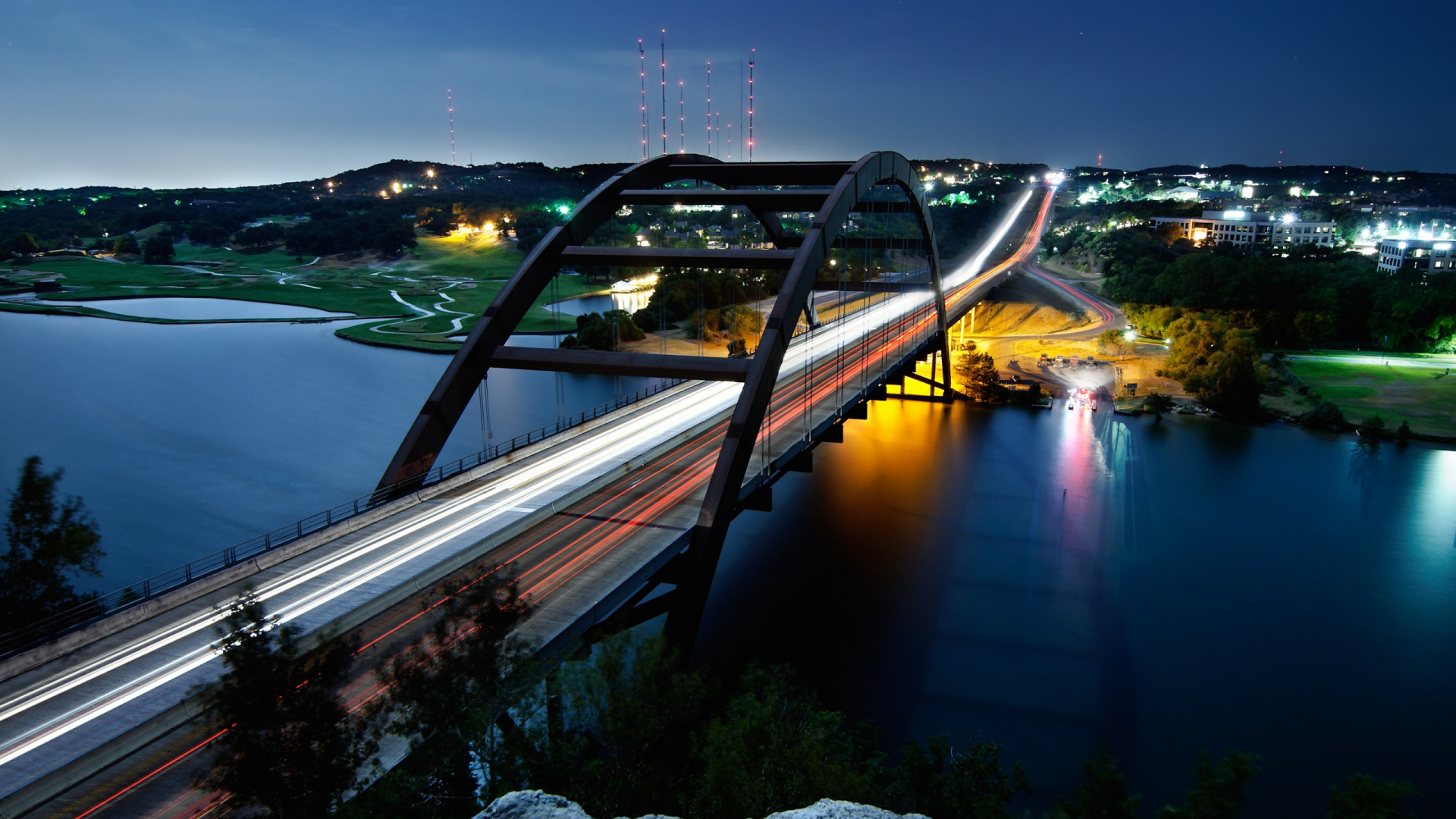 Brown Bridge Over Body of Water During Night Time. Wallpaper in 1920x1080 Resolution