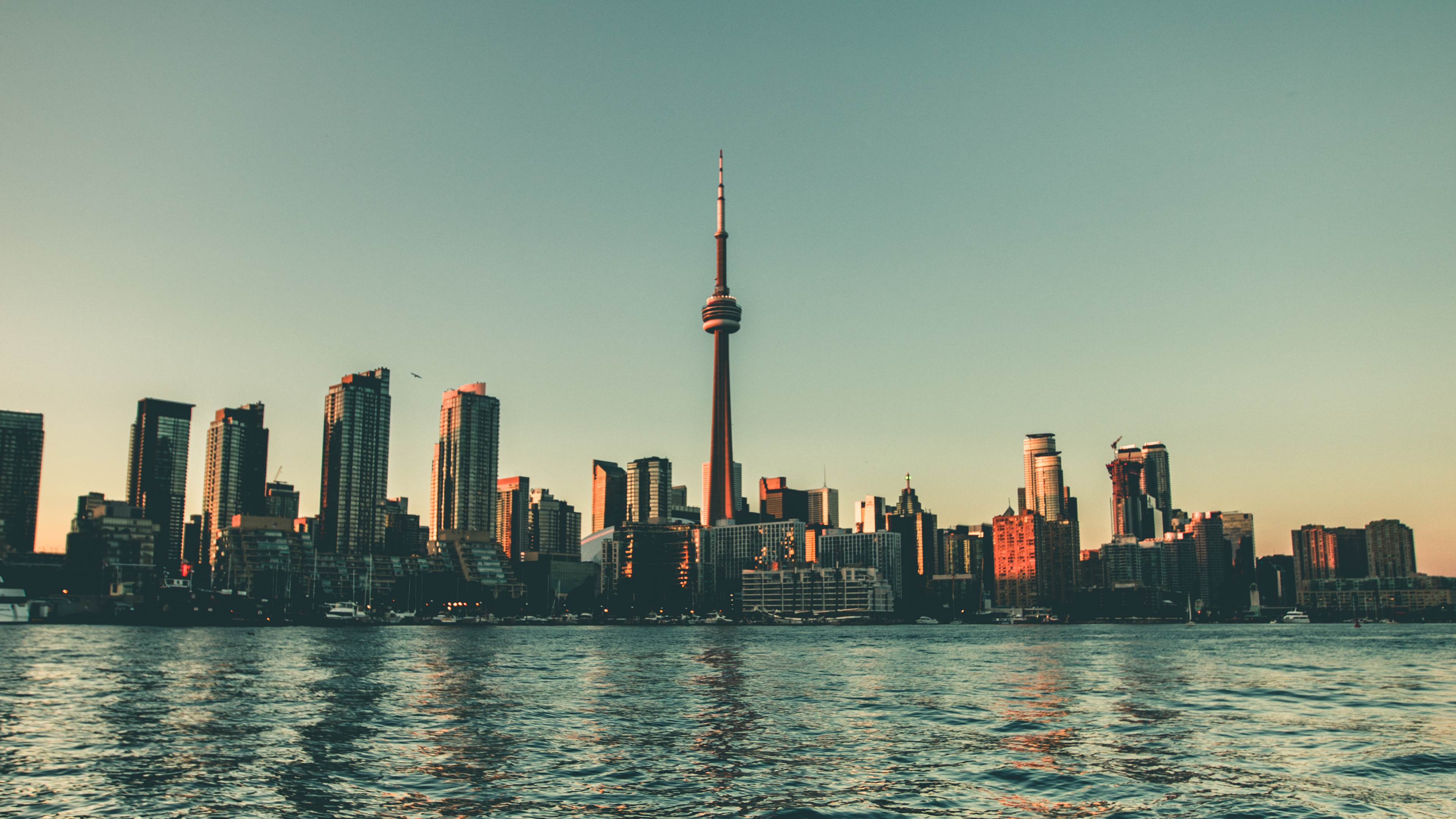 City Skyline Across Body of Water During Daytime. Wallpaper in 3840x2160 Resolution