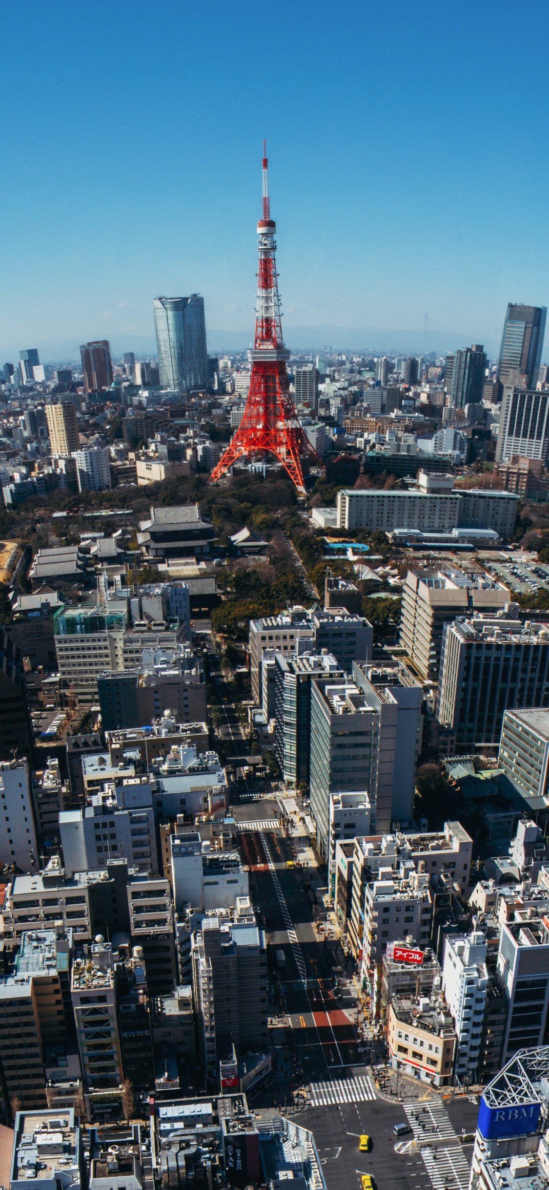 Torre Roja en la Ciudad Durante el Día. Wallpaper in 1125x2436 Resolution