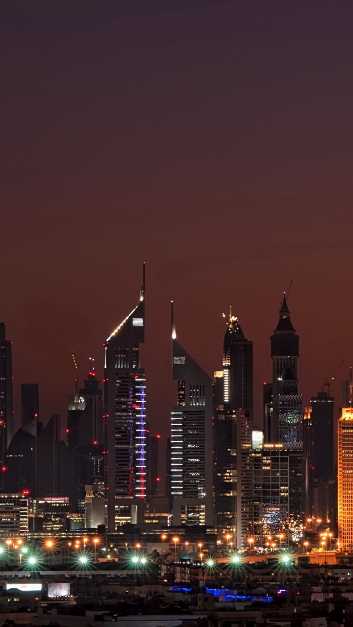 City Skyline During Night Time. Wallpaper in 720x1280 Resolution