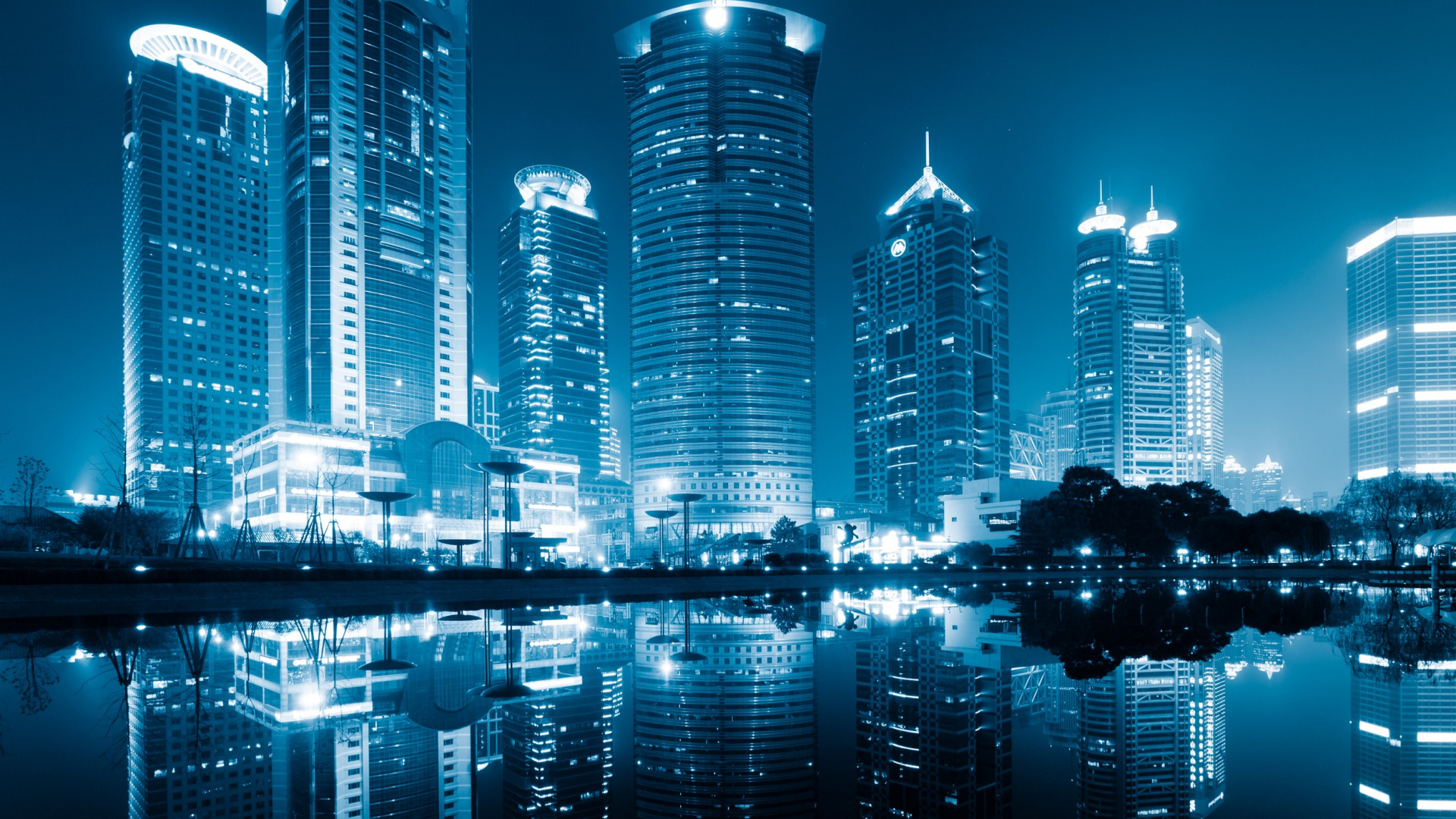 City Skyline Across Body of Water During Night Time. Wallpaper in 1920x1080 Resolution