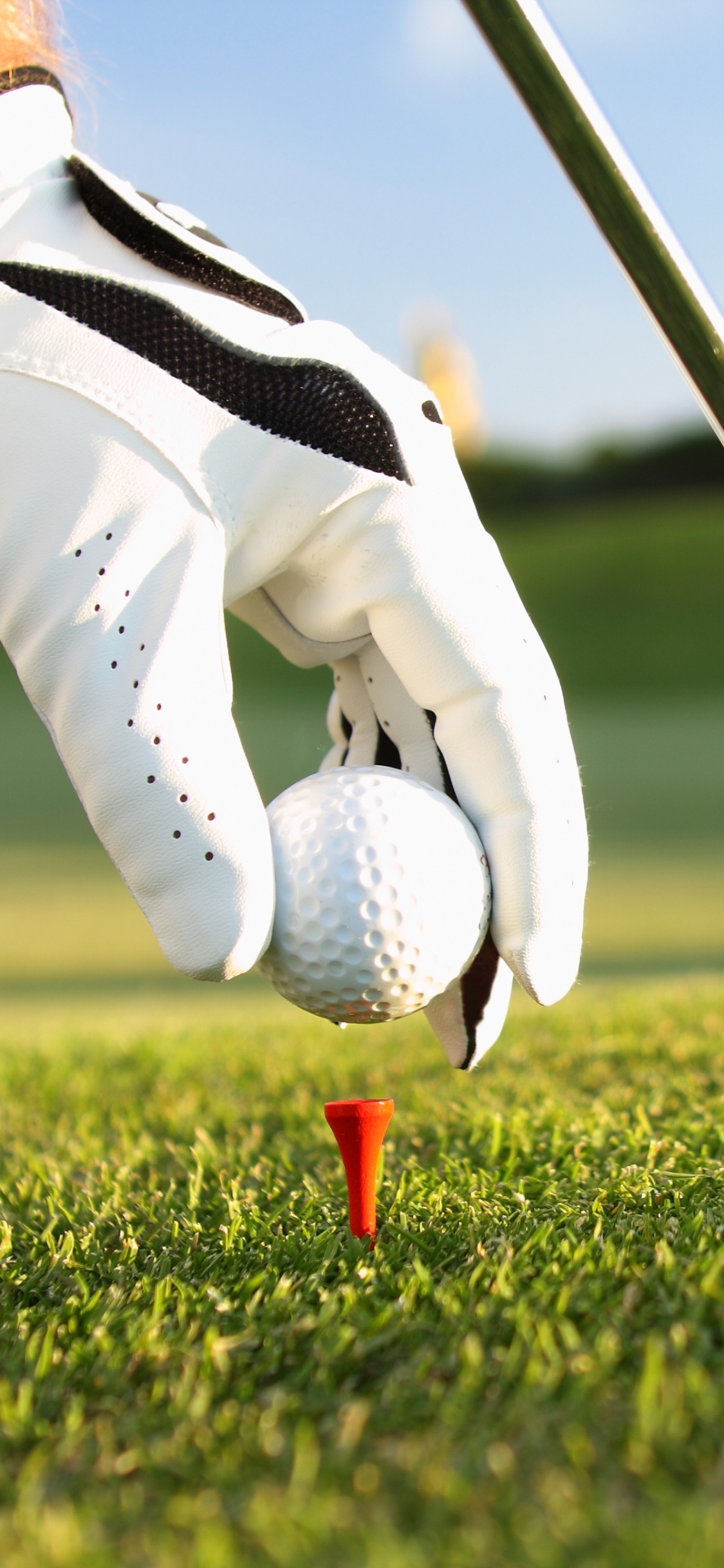 Person in White Pants and White Nike Shoes Holding Golf Club. Wallpaper in 1125x2436 Resolution