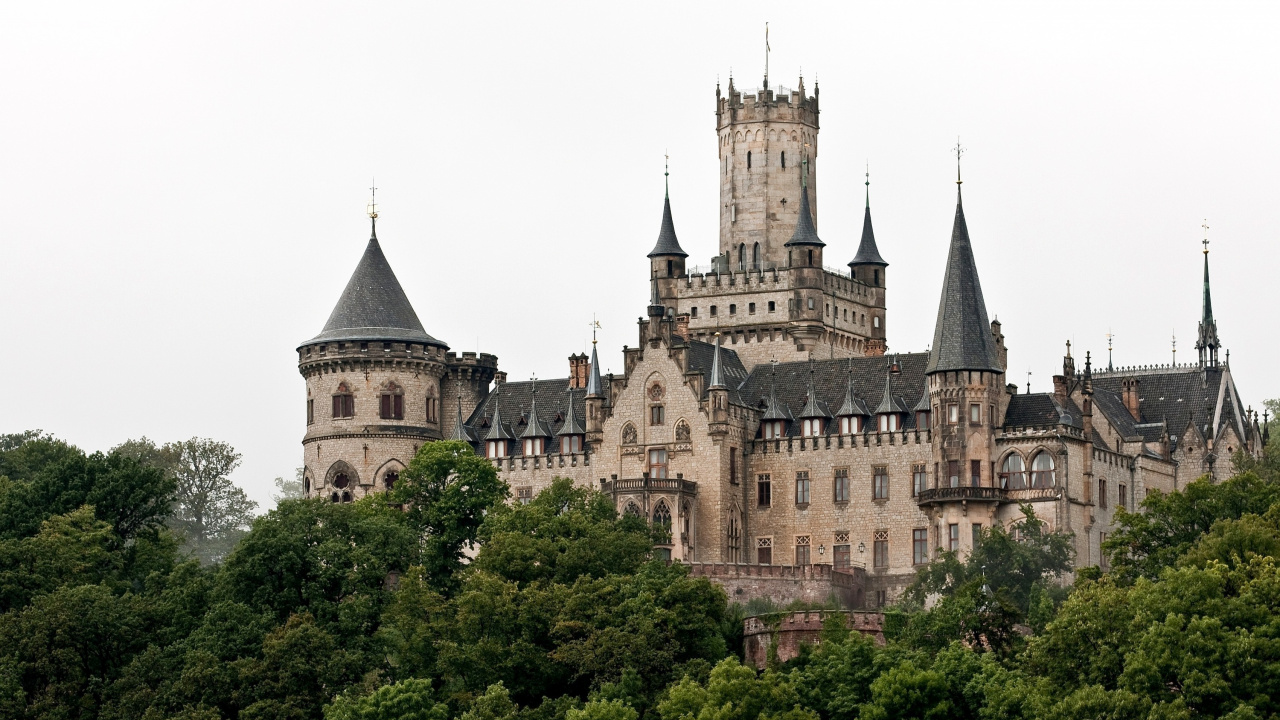 Brown and Gray Concrete Castle Surrounded by Green Trees During Daytime. Wallpaper in 1280x720 Resolution