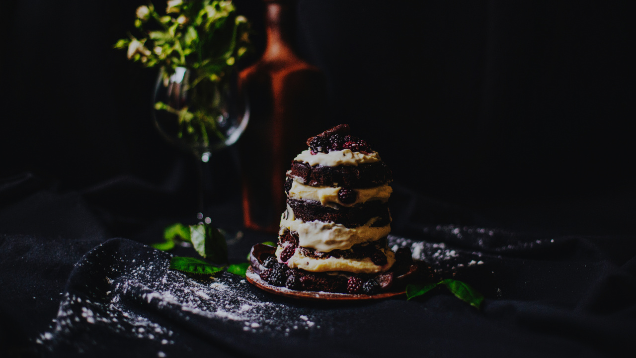 Brown and White Cupcake on Black Table. Wallpaper in 1280x720 Resolution