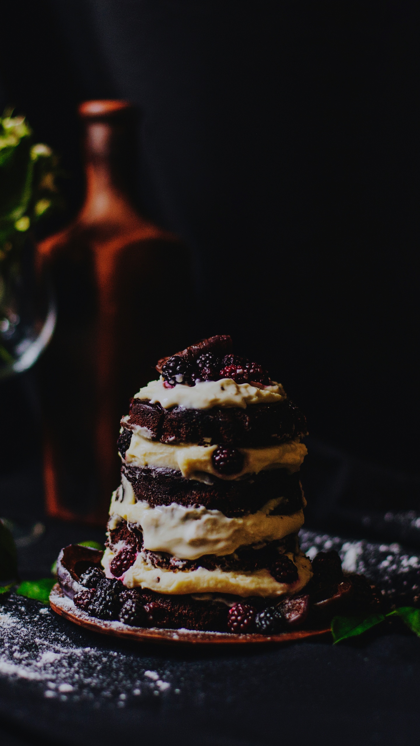 Brown and White Cupcake on Black Table. Wallpaper in 1440x2560 Resolution