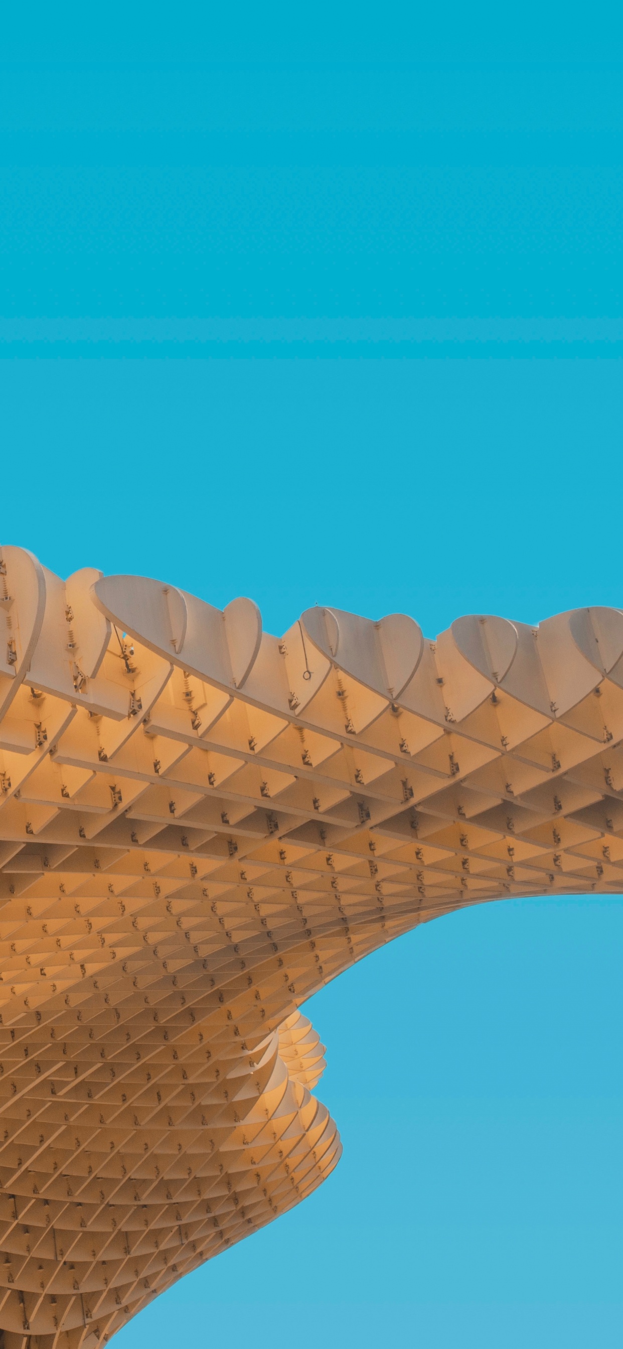 Brown Concrete Building Under Blue Sky During Daytime. Wallpaper in 1242x2688 Resolution