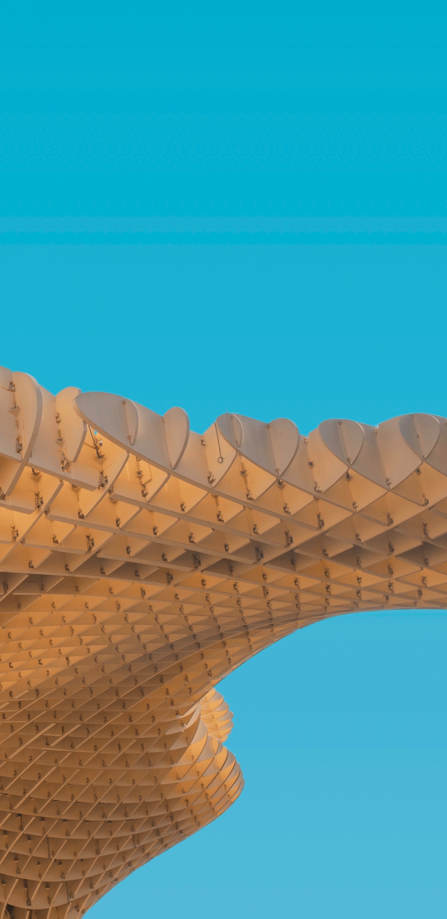 Brown Concrete Building Under Blue Sky During Daytime. Wallpaper in 1440x2960 Resolution