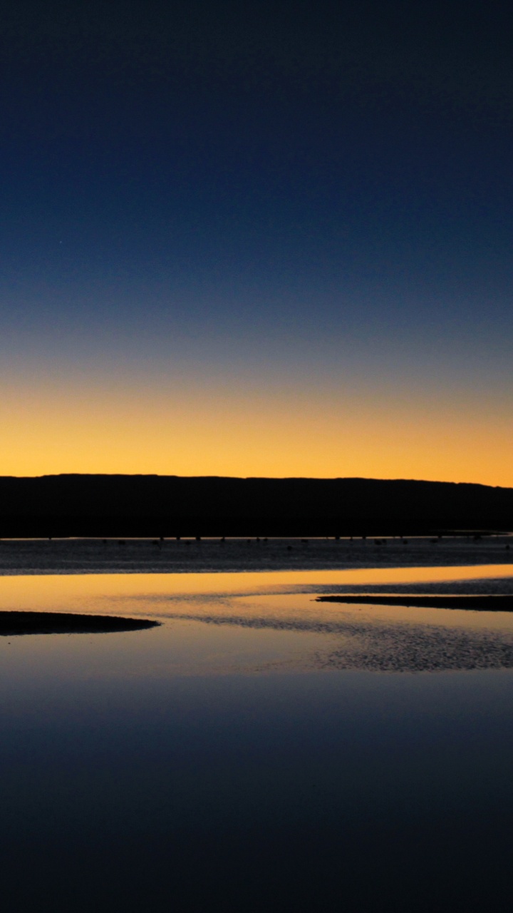 Silhouette of Mountain Near Body of Water During Daytime. Wallpaper in 720x1280 Resolution