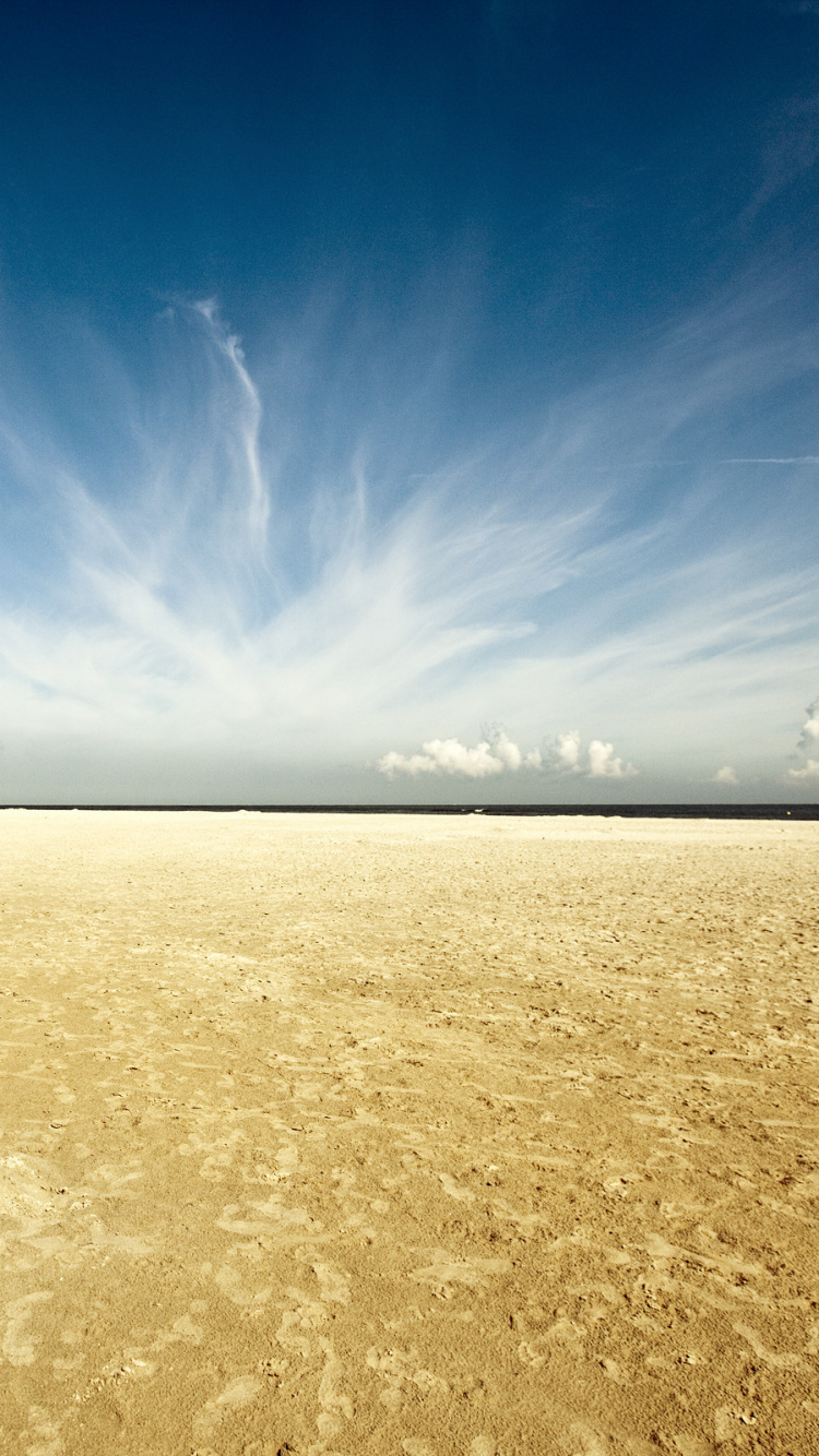 Brown Sand Under Blue Sky During Daytime. Wallpaper in 750x1334 Resolution