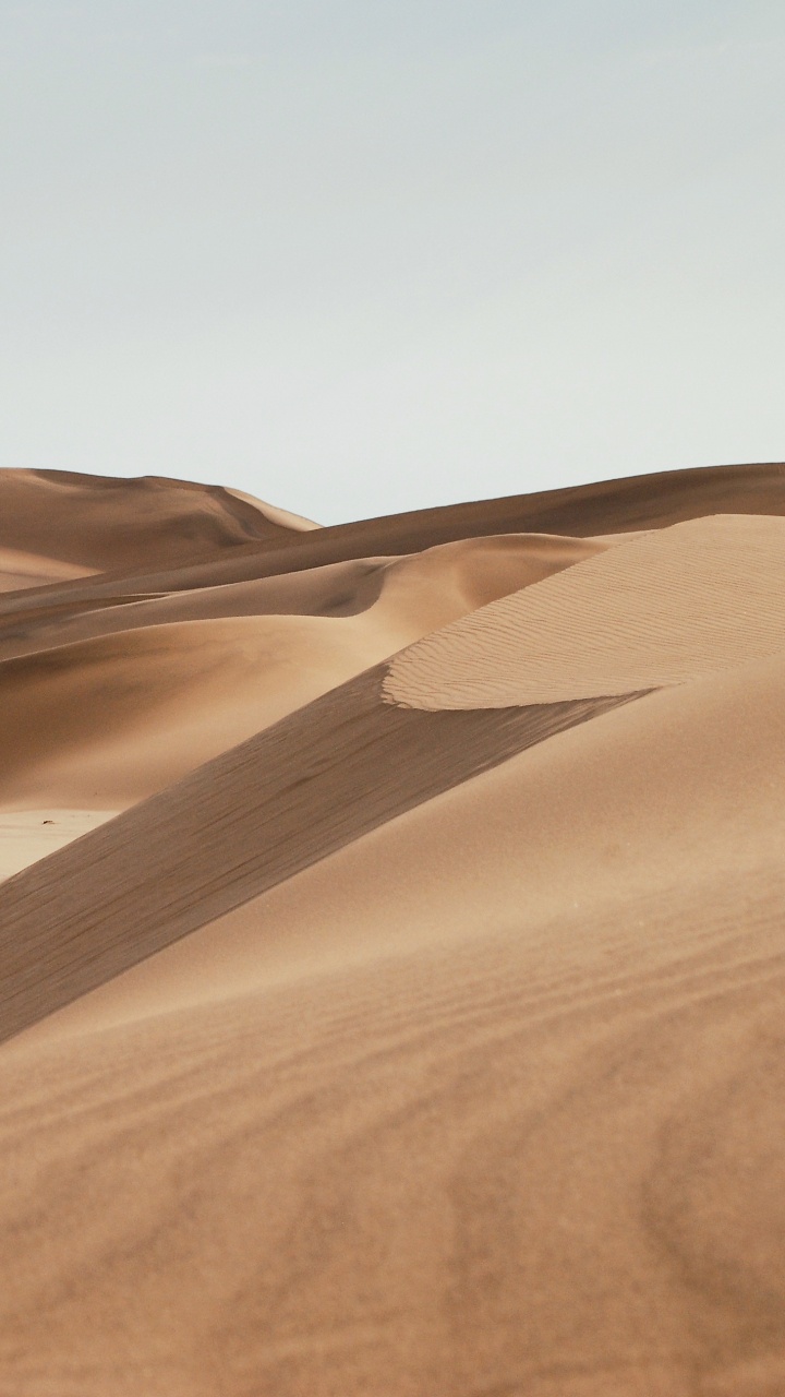 Brown Sand Under Blue Sky During Daytime. Wallpaper in 720x1280 Resolution