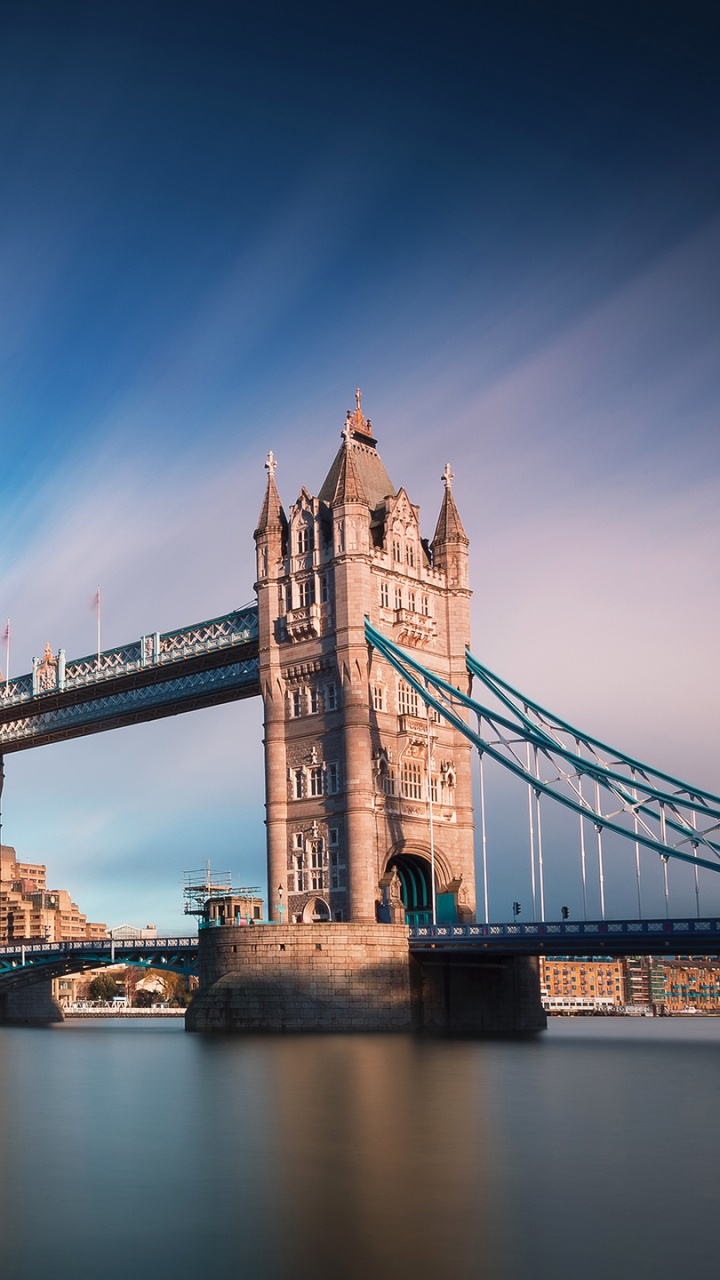 Brown Bridge Over River Under Blue Sky. Wallpaper in 720x1280 Resolution