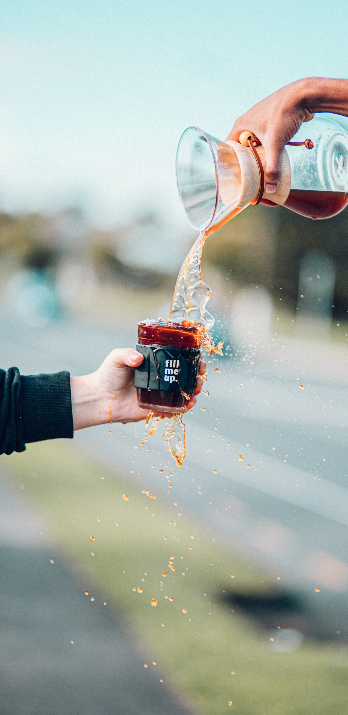 Person Pouring Water on Red Ceramic Mug. Wallpaper in 1440x2960 Resolution