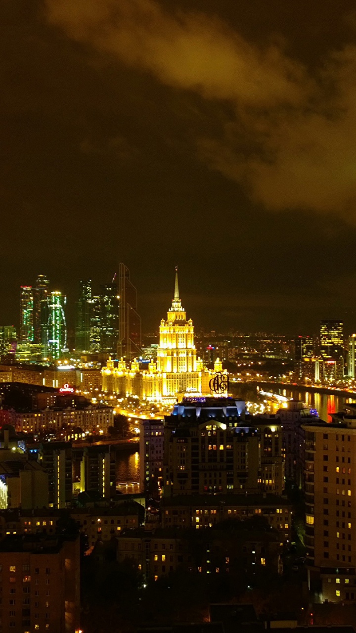 City With High Rise Buildings During Night Time. Wallpaper in 720x1280 Resolution