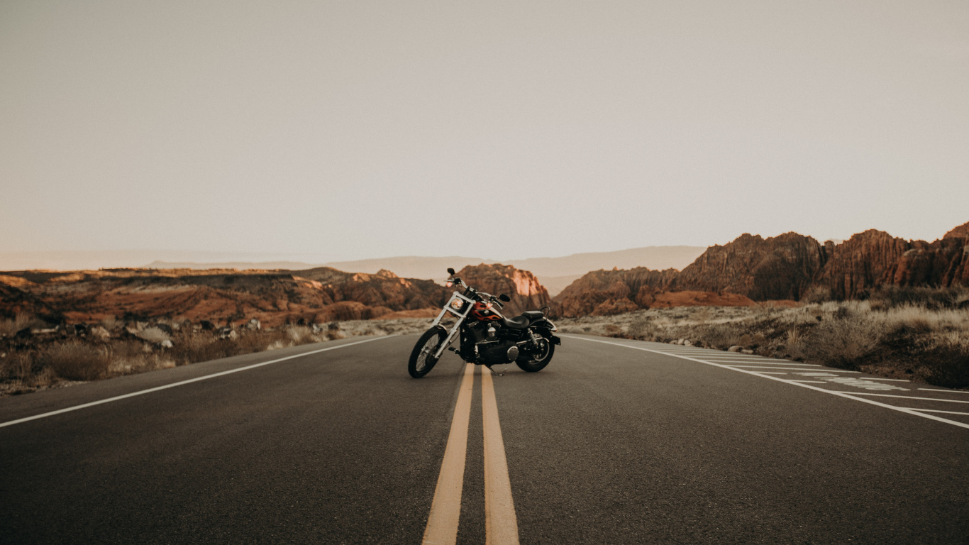 Black and White Motorcycle on Road During Daytime. Wallpaper in 1366x768 Resolution