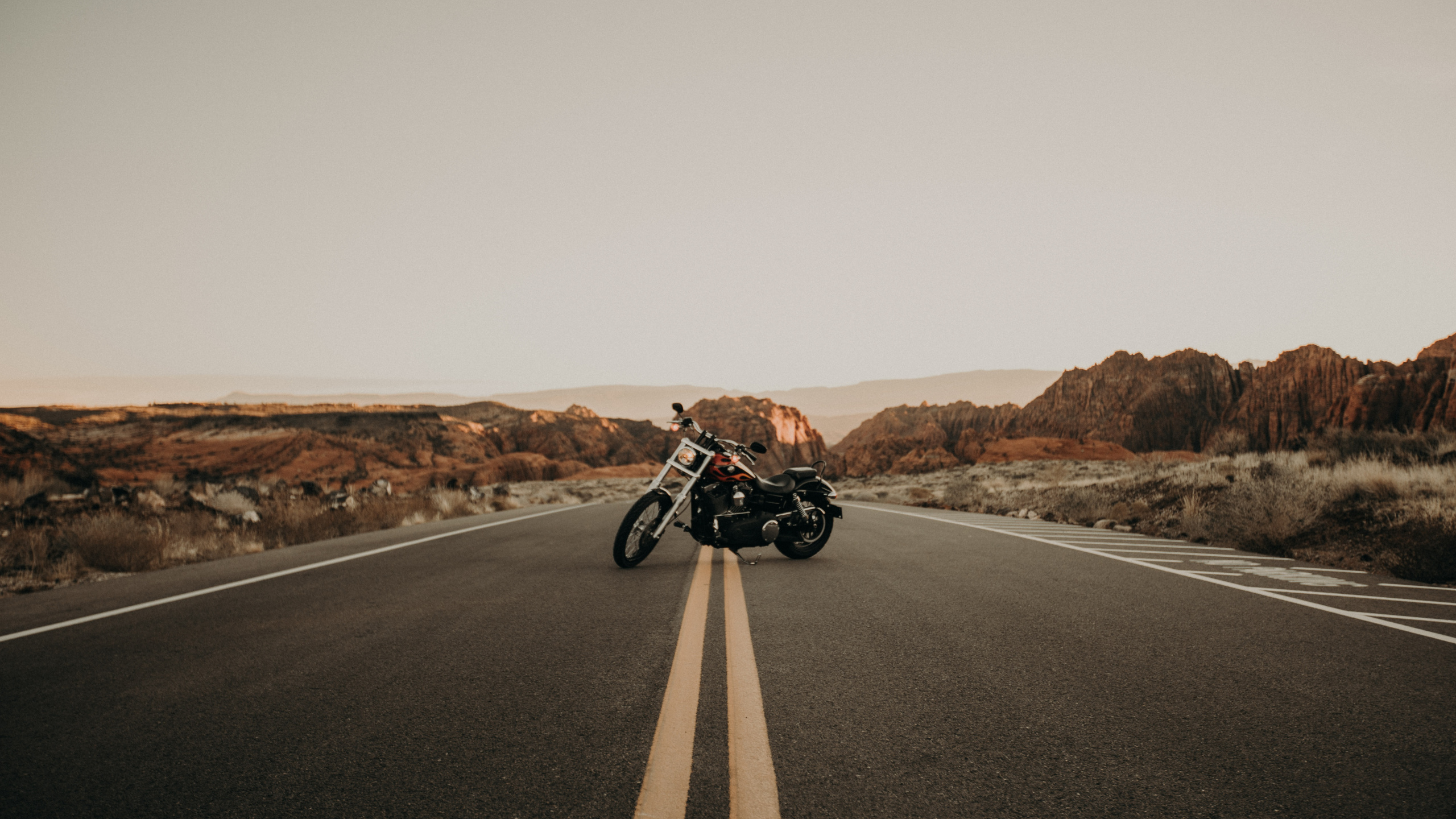 Black and White Motorcycle on Road During Daytime. Wallpaper in 2560x1440 Resolution