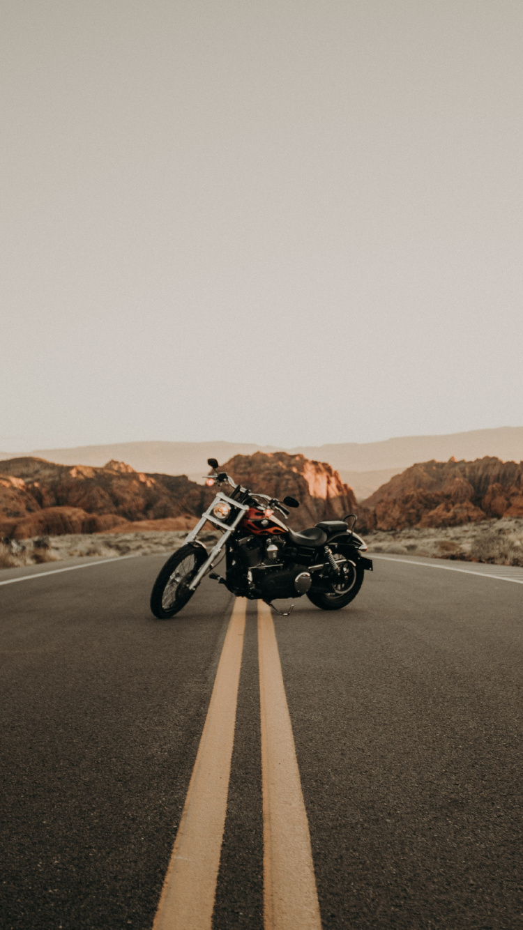 Black and White Motorcycle on Road During Daytime. Wallpaper in 750x1334 Resolution