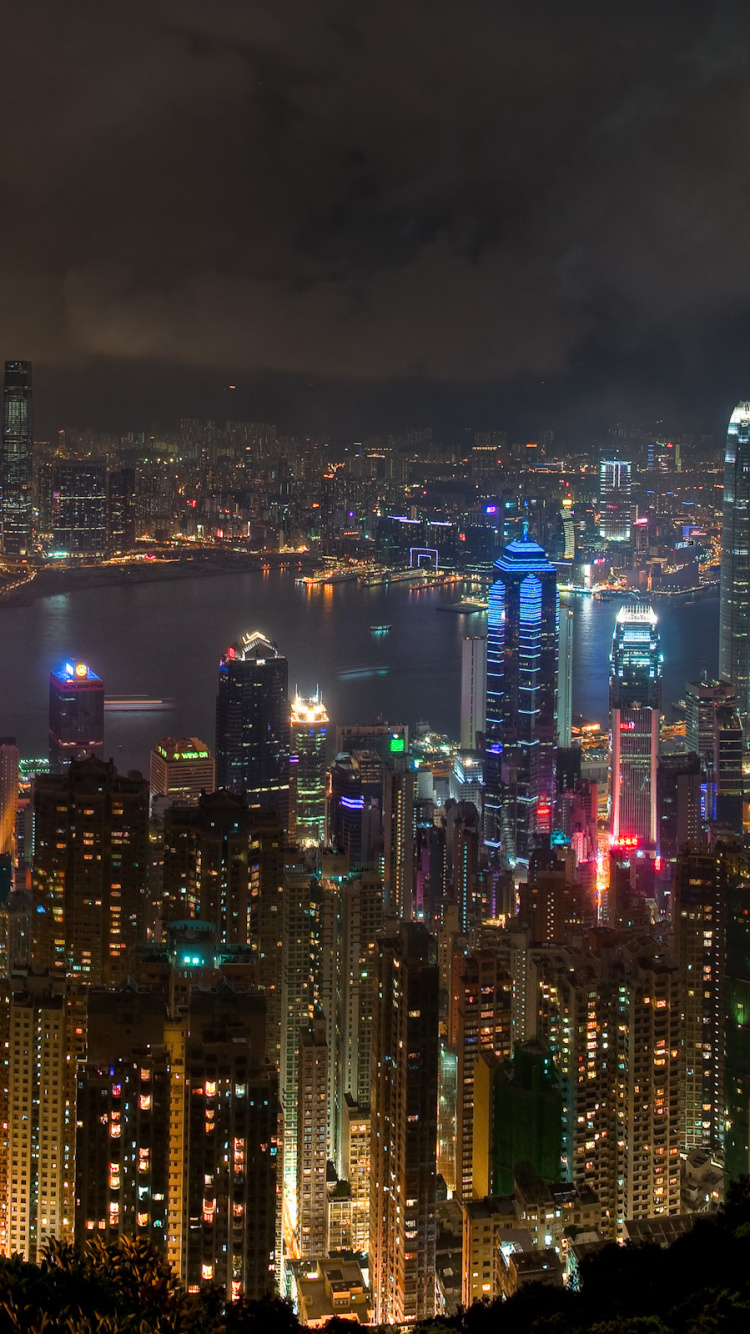 City With High Rise Buildings During Night Time. Wallpaper in 750x1334 Resolution