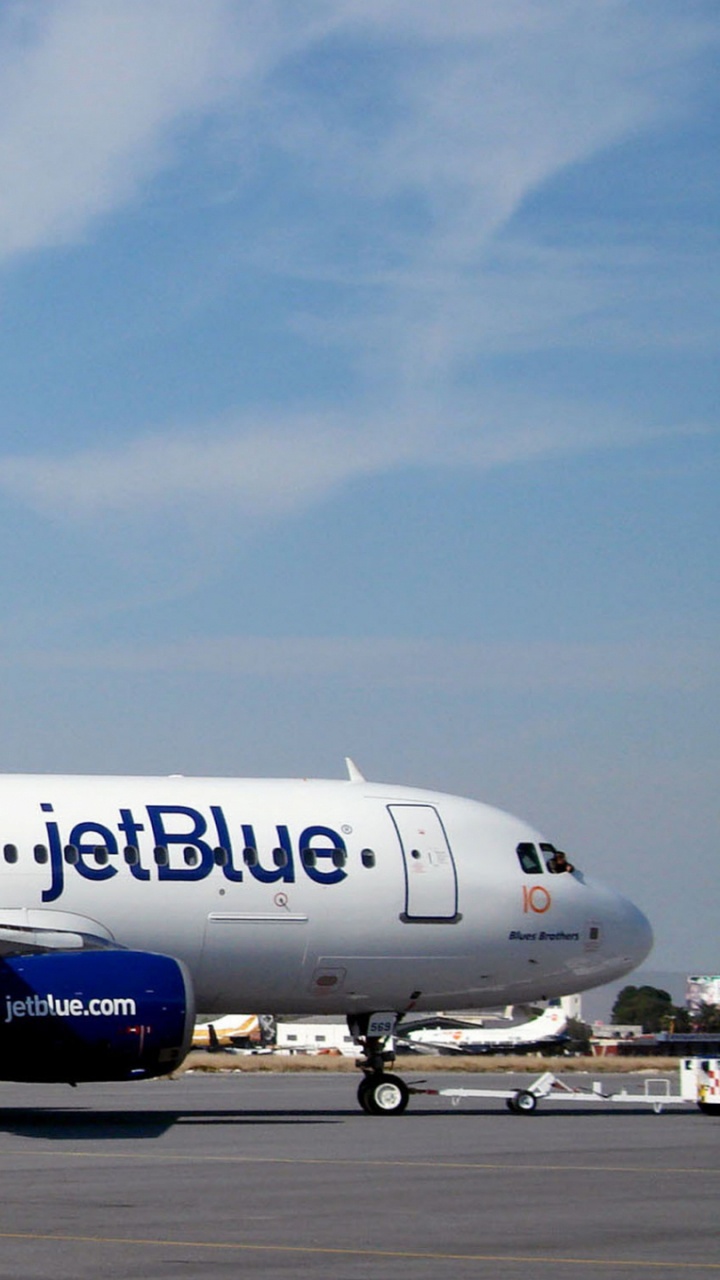 White and Blue Passenger Plane on Airport During Daytime. Wallpaper in 720x1280 Resolution